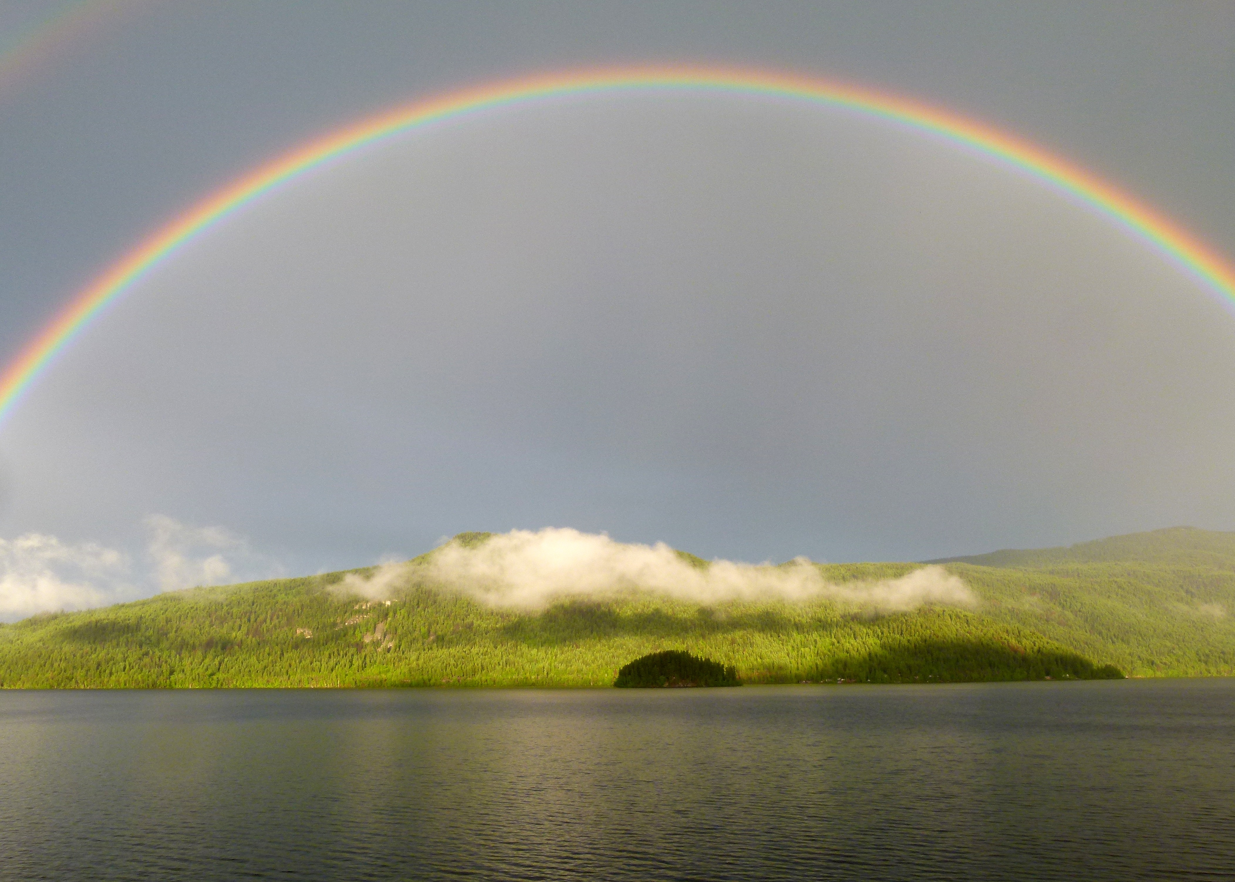 Free photo A big rainbow over the island