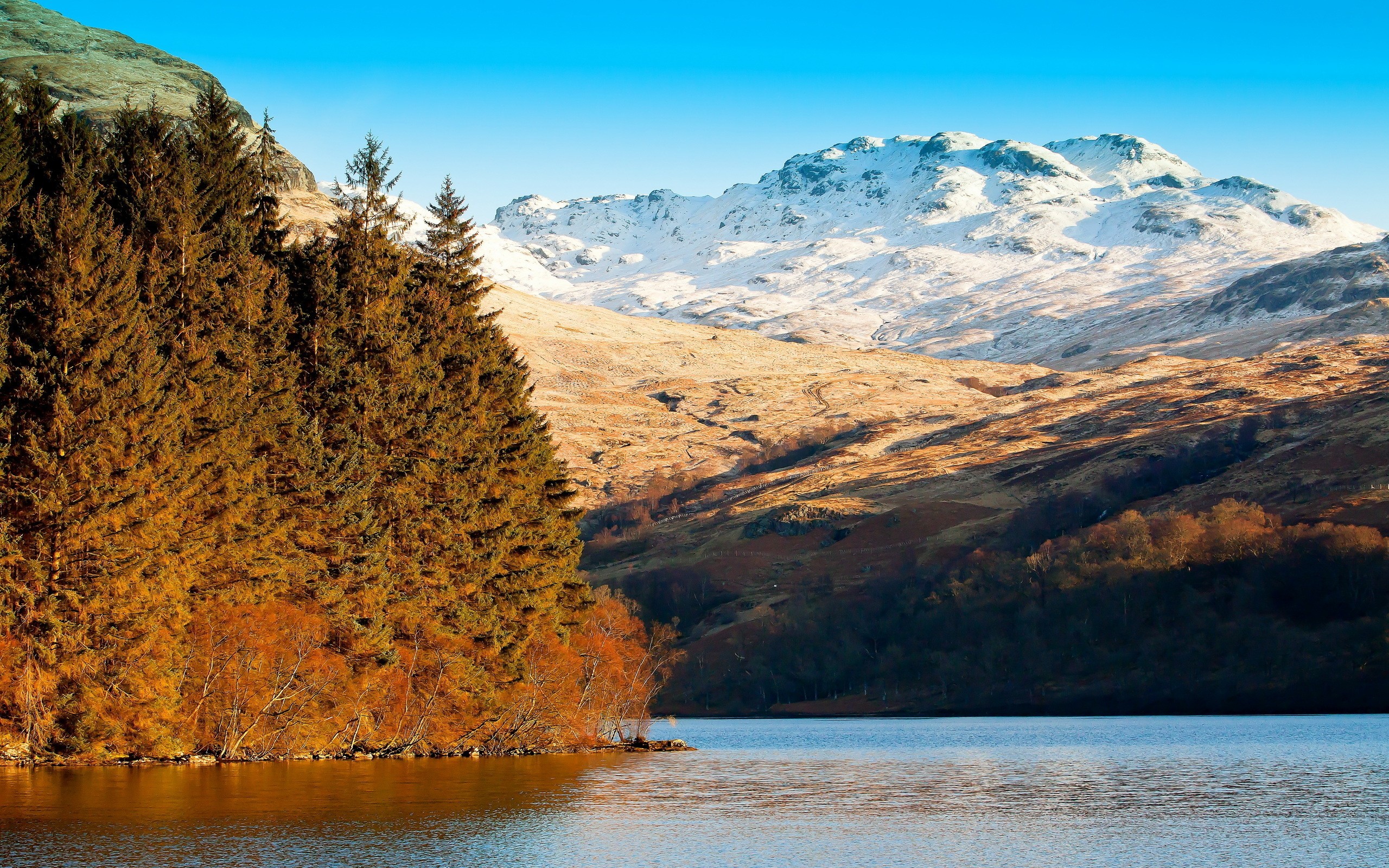 A photo of a mountain landscape with snow