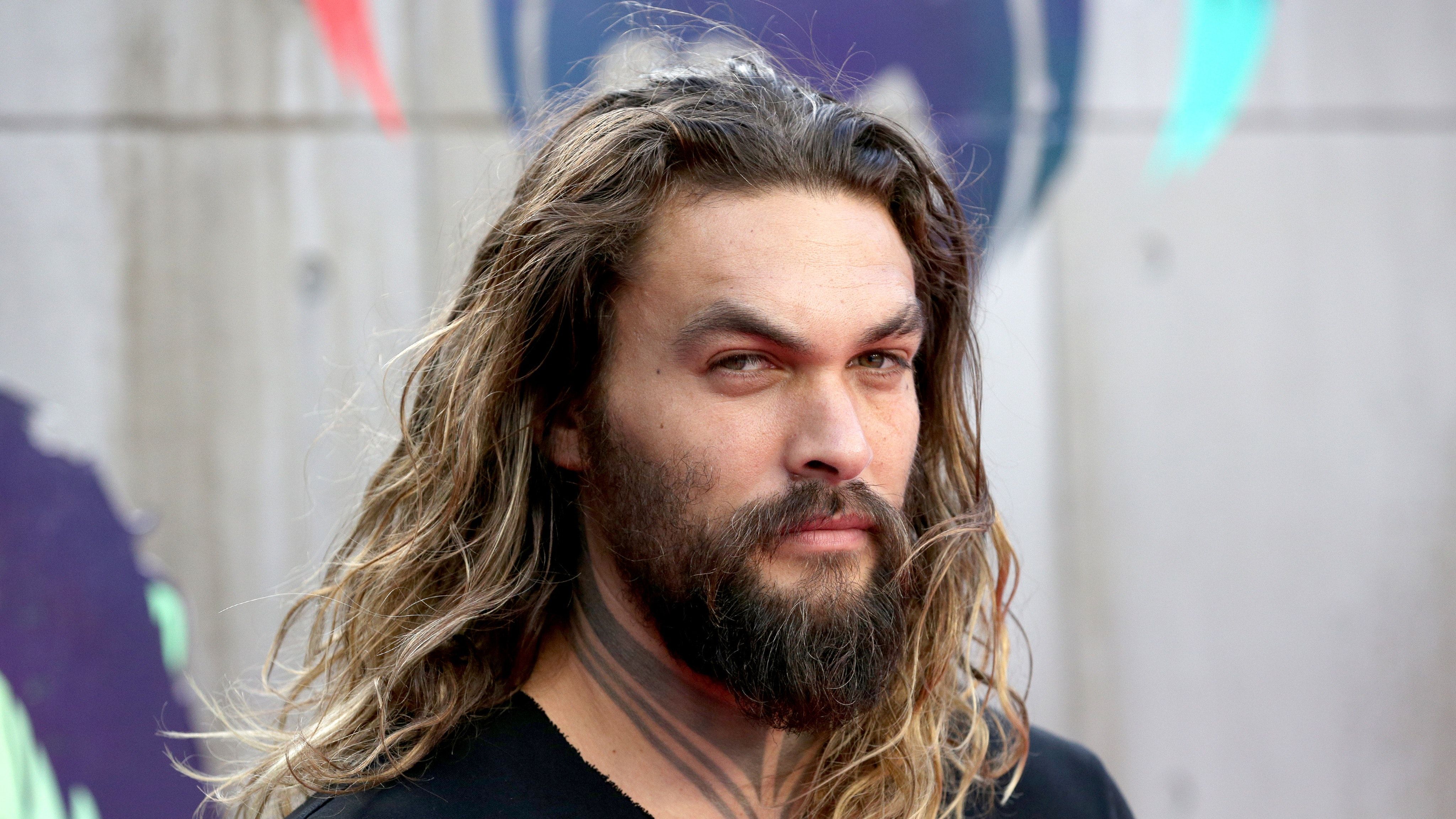 Free photo Bearded Jason Momoa with long hair.