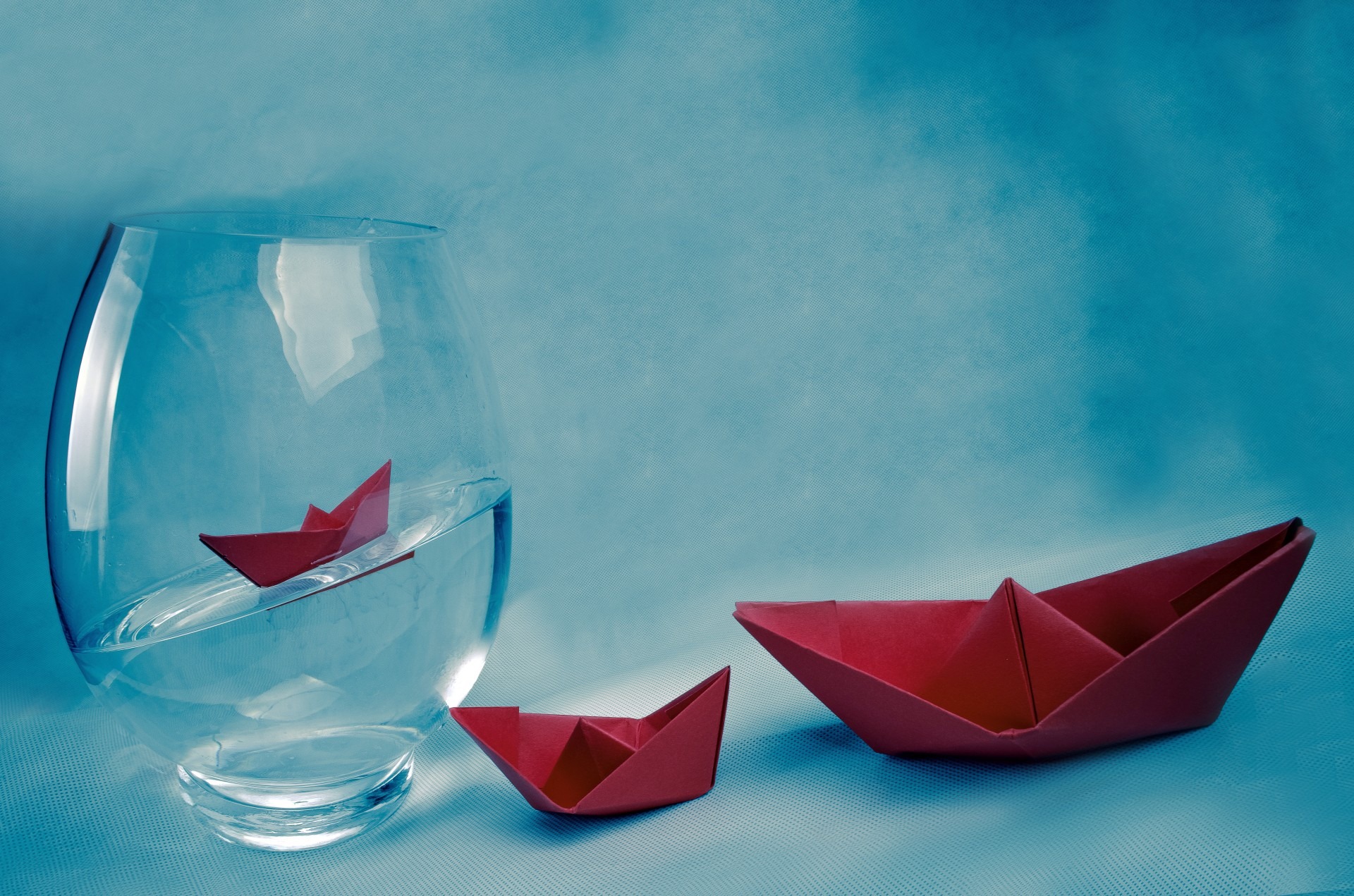 Paper boats in a vase of water