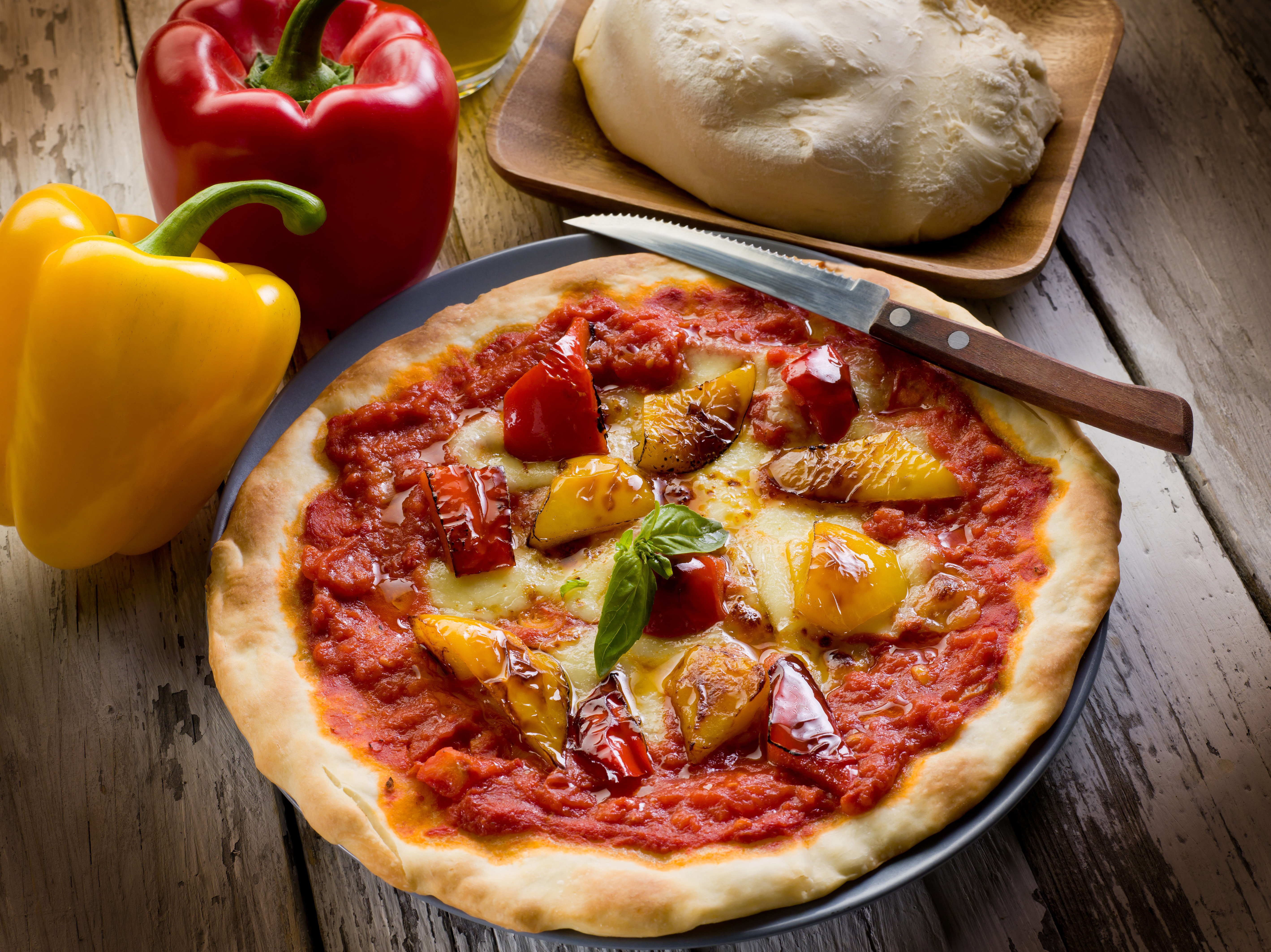 Freshly baked pizza and knife