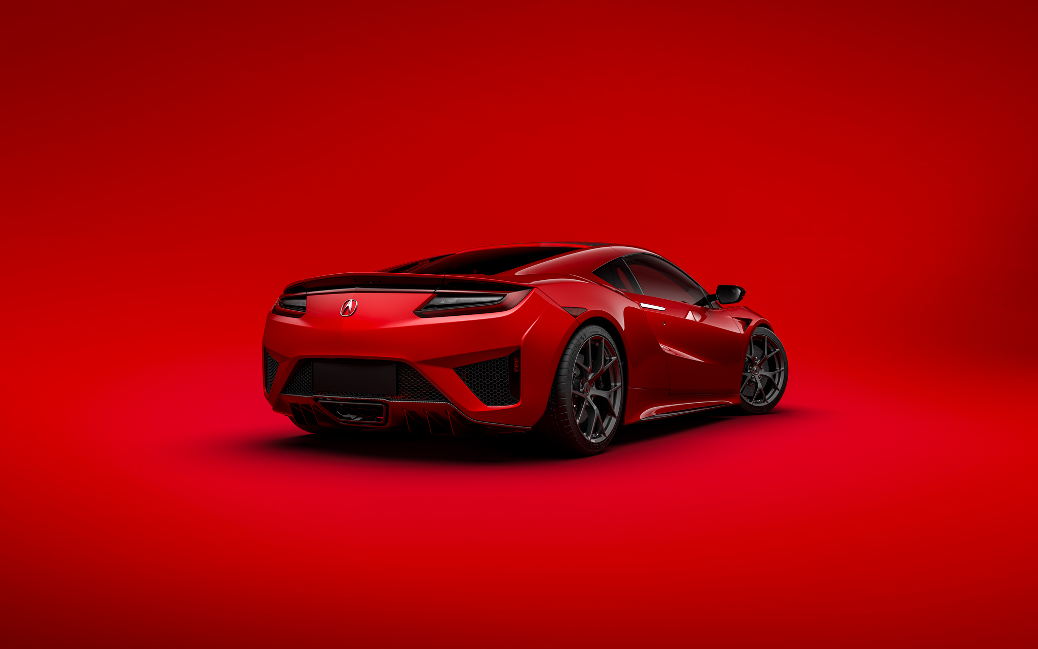 红色背景上的红色 Acura 后视图