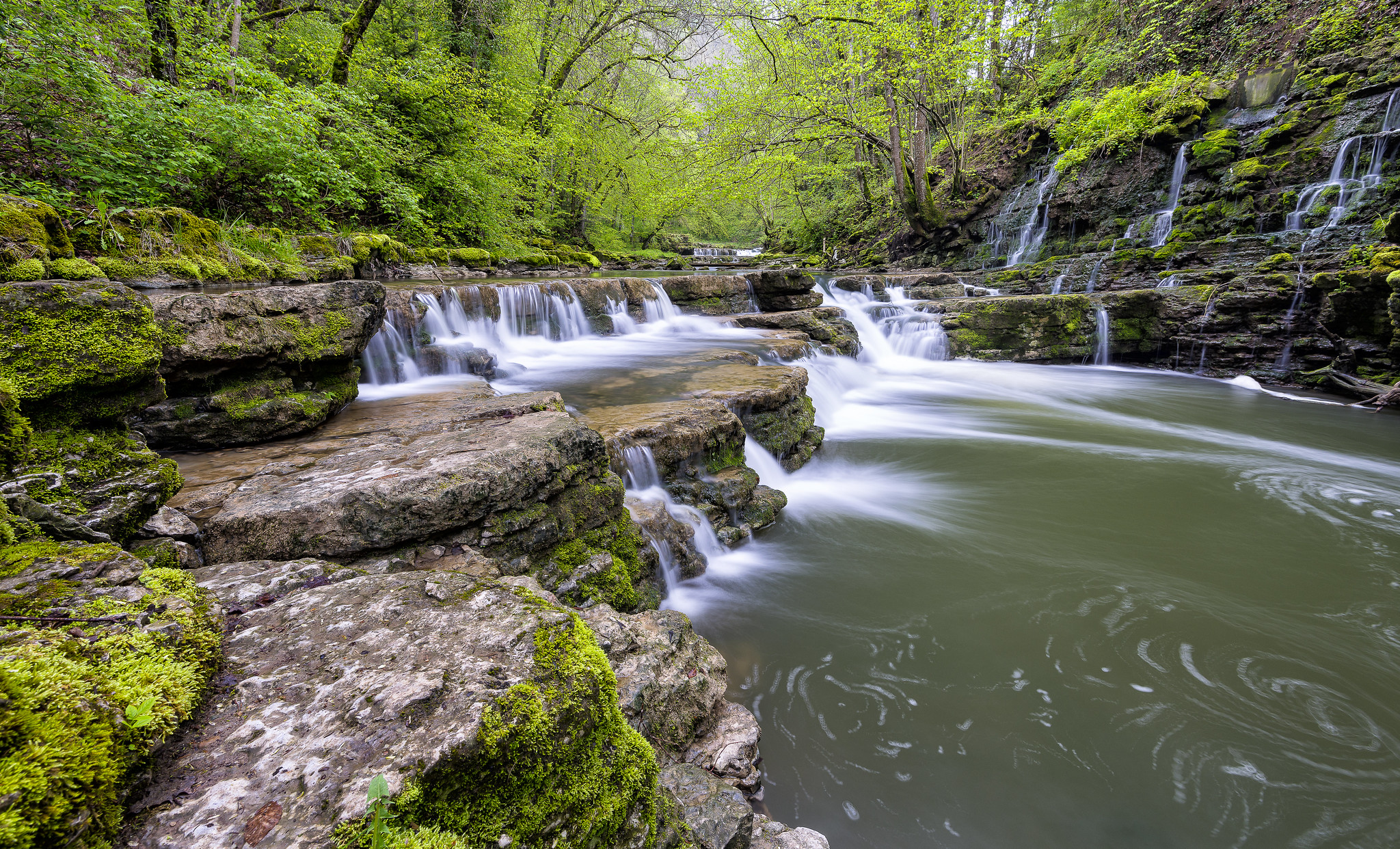 Free photo River with waterfalls and ferries