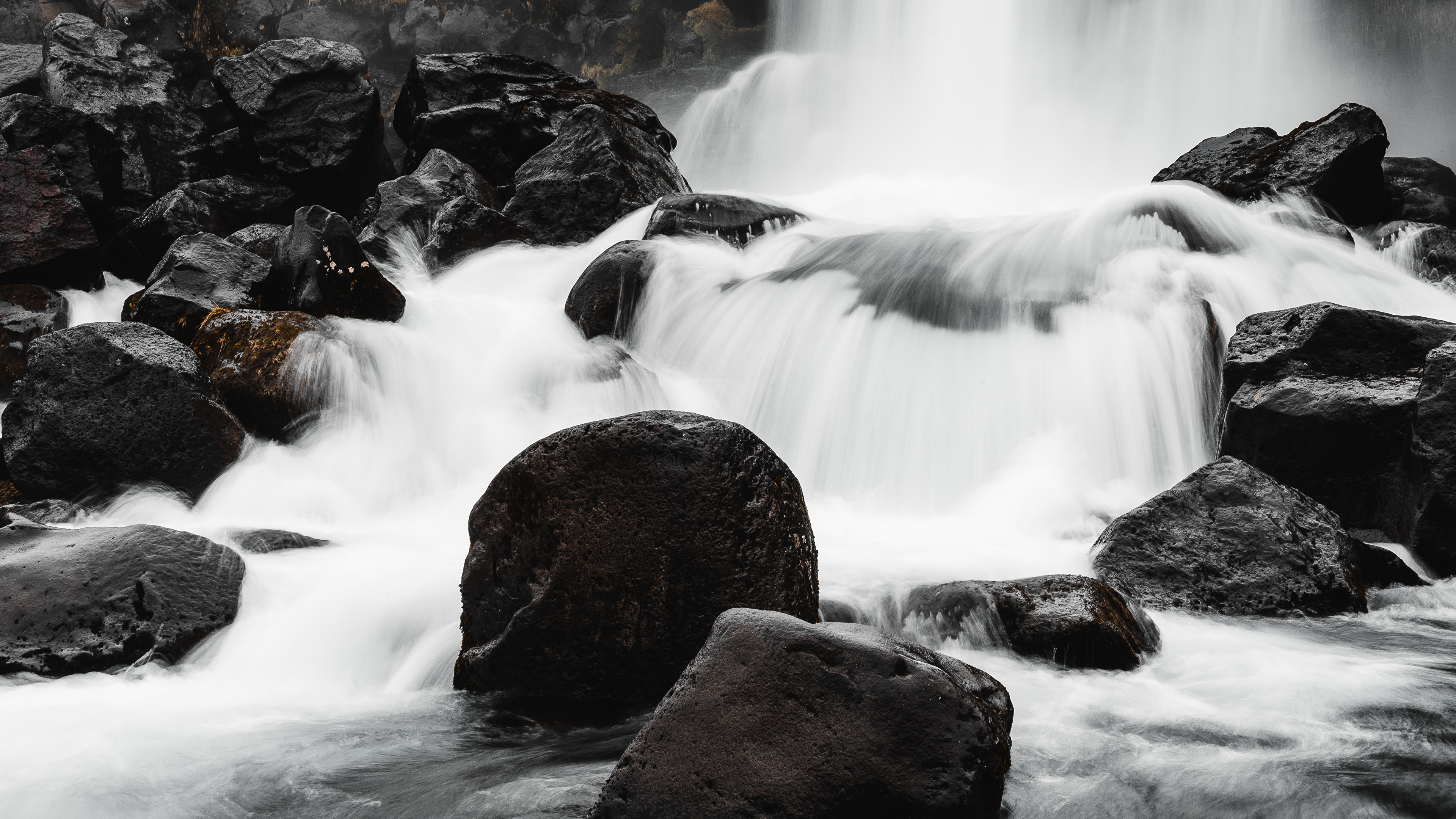 Free photo Waterfall on black cliffs