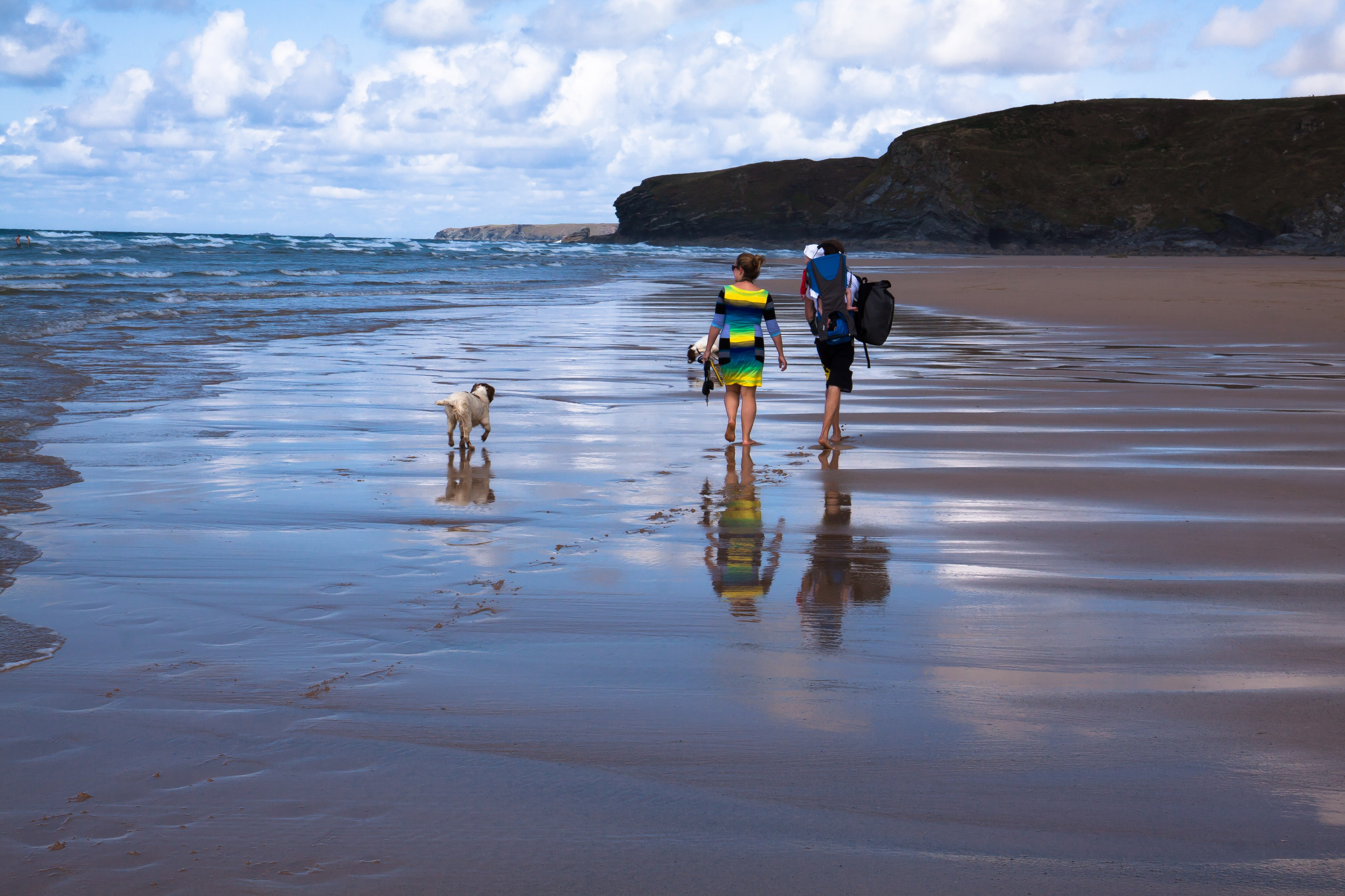 Free photo A family walk along the beach