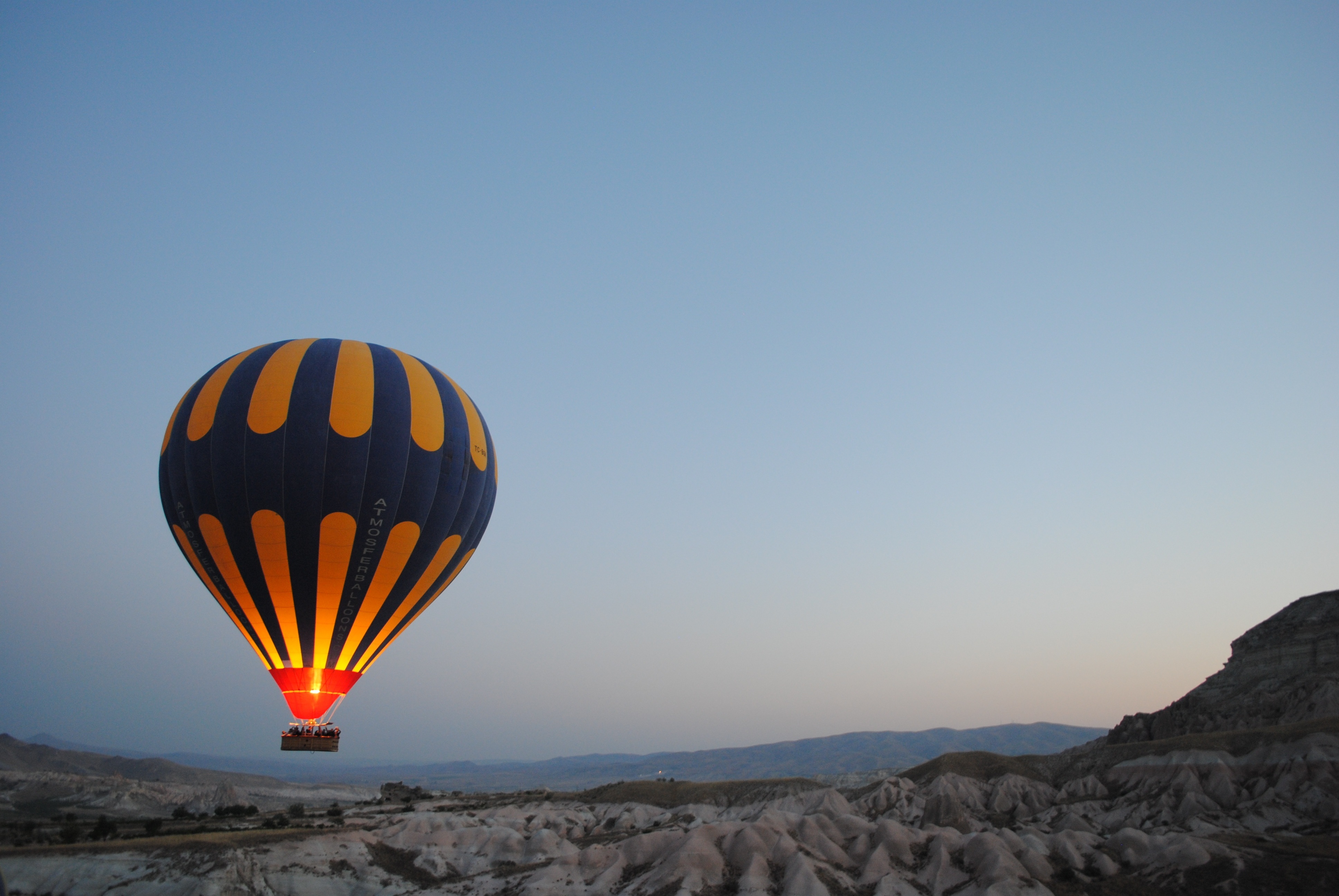 Free photo A hot air balloon over the mountains