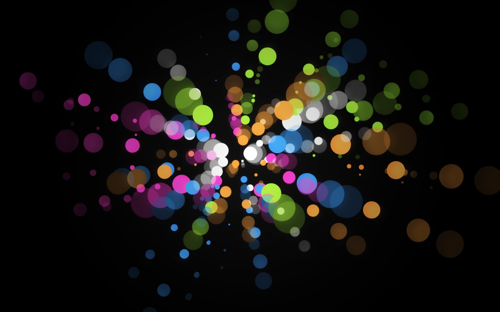 Free photo Wallpaper with colored abstract circles on a black background