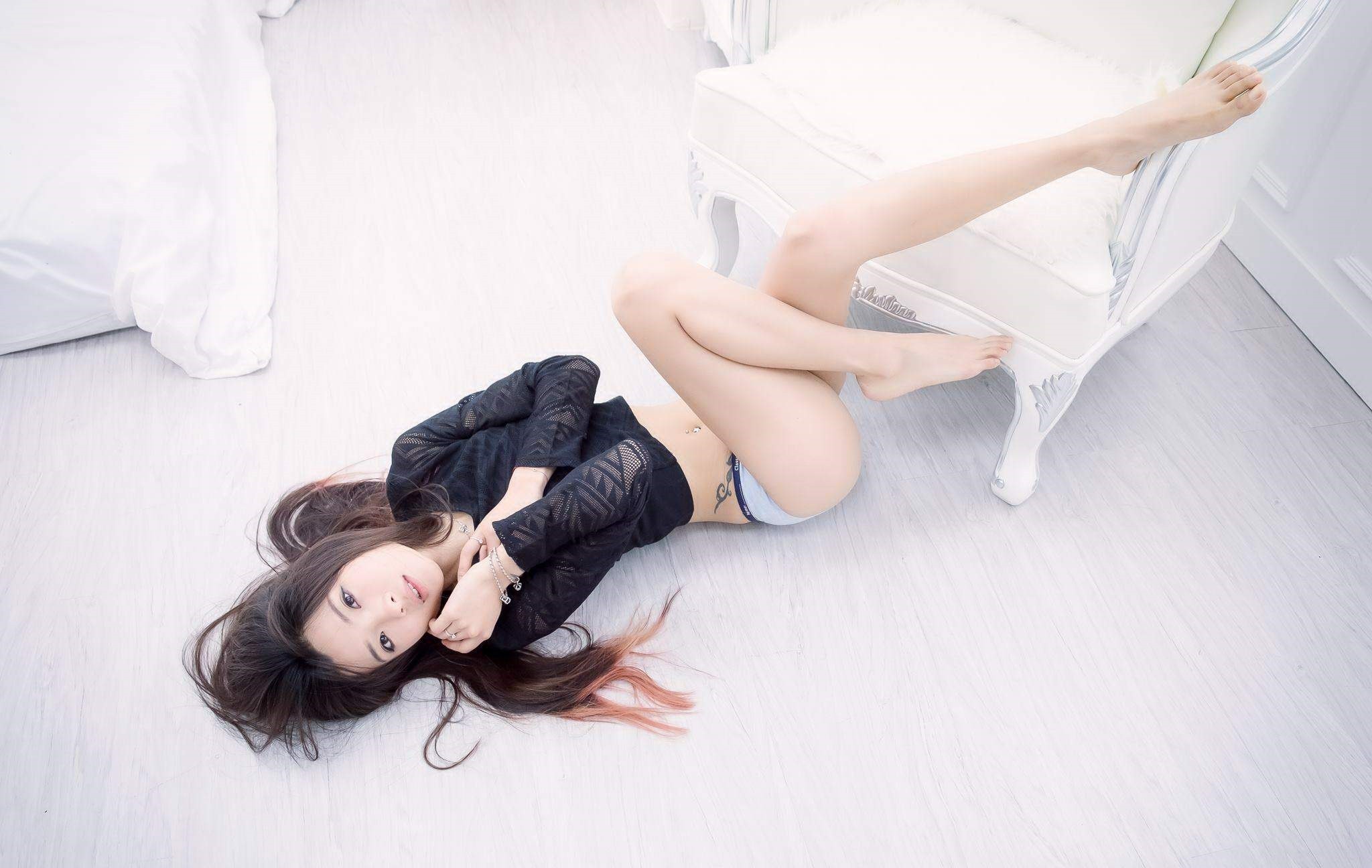 Beautiful Asian girl lying on the floor