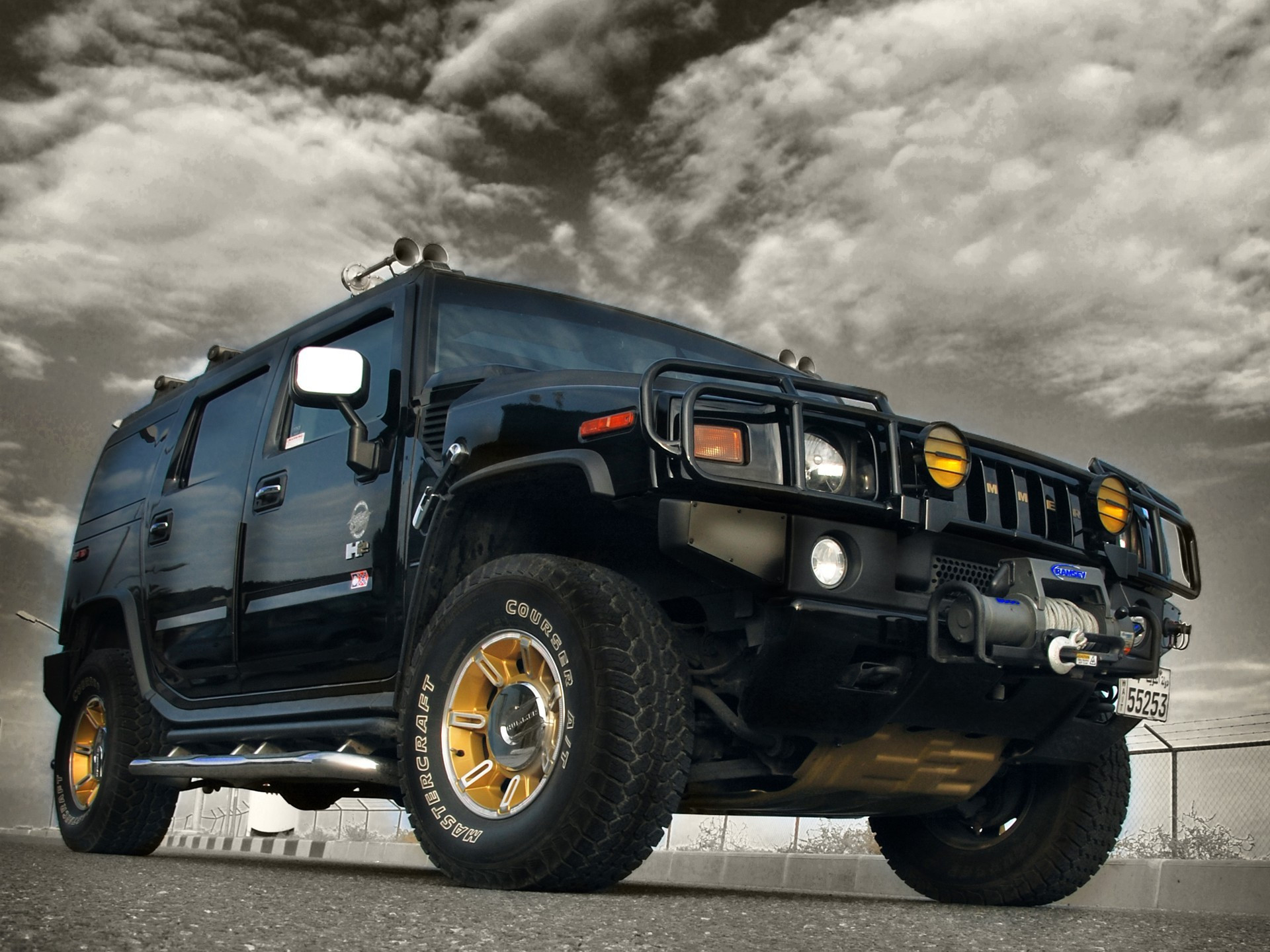 Free photo Black Hummer on Gold Wheels