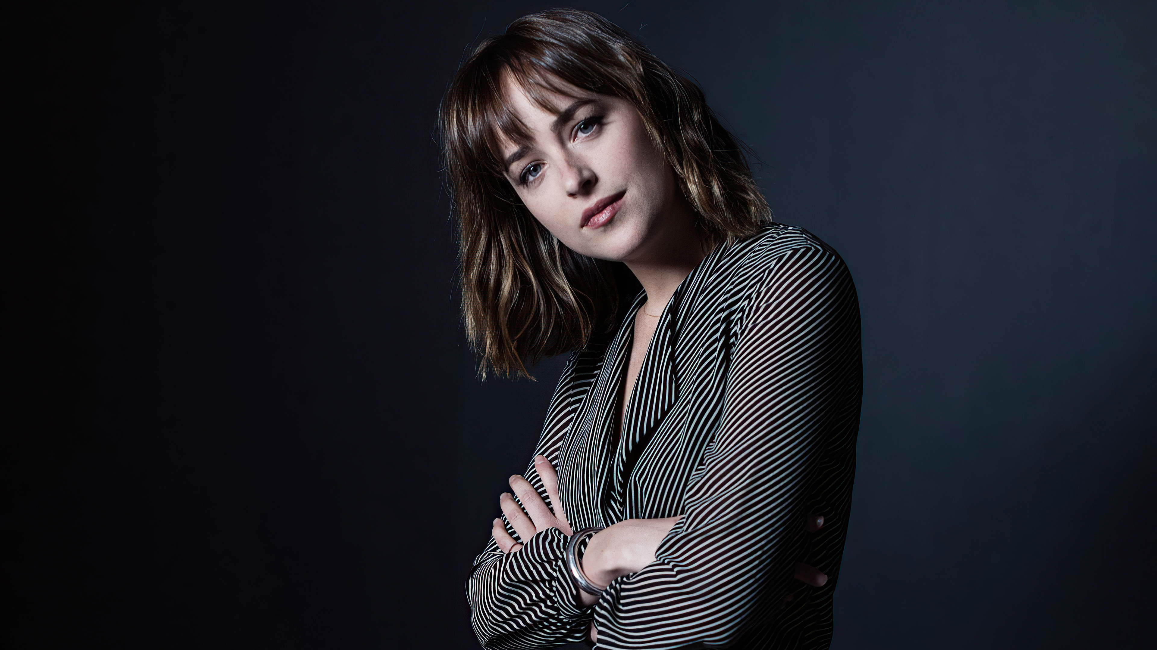 Free photo Brunette Dakota Johnson on black background