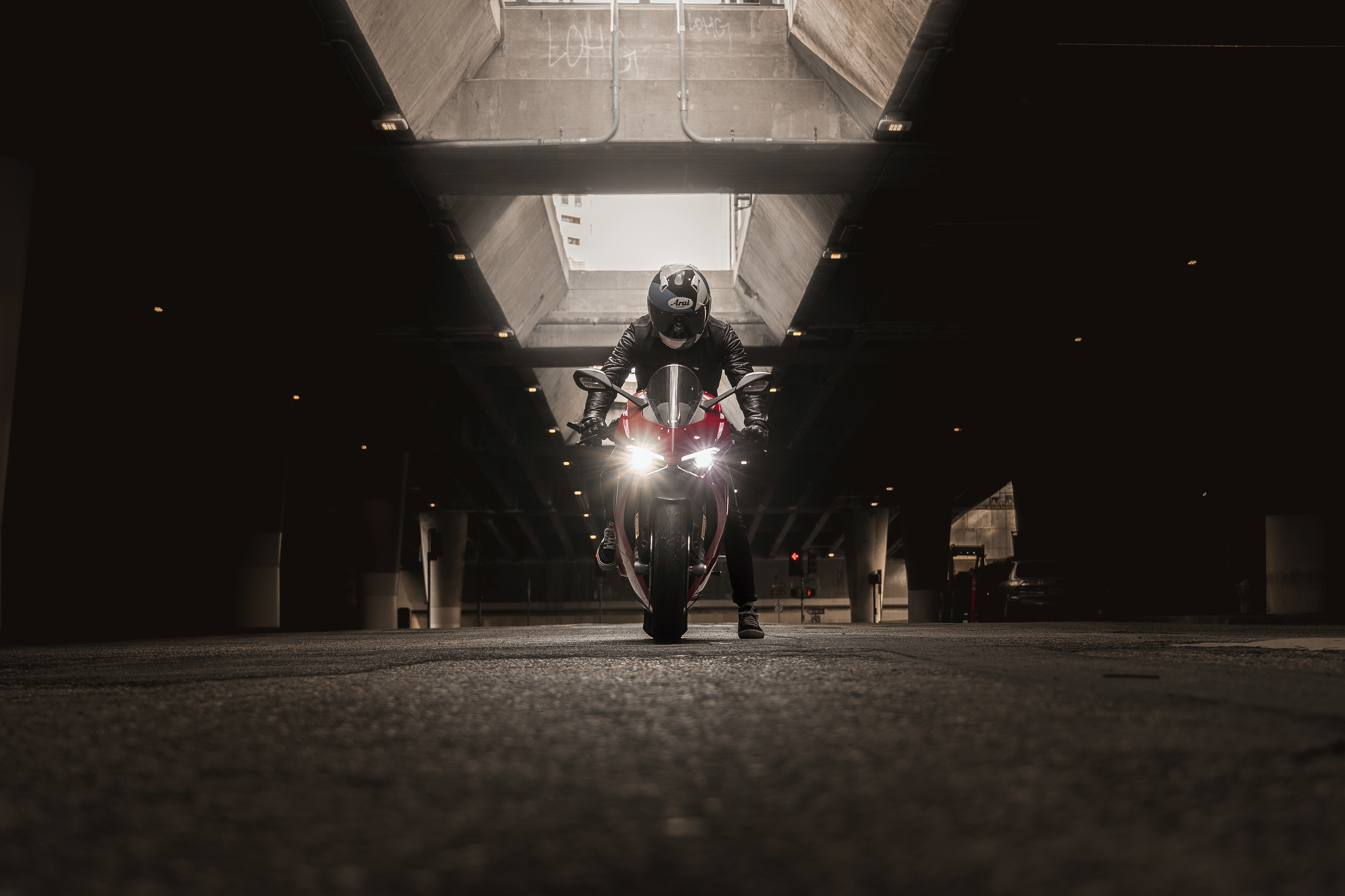 Free photo A biker on a red Ducati