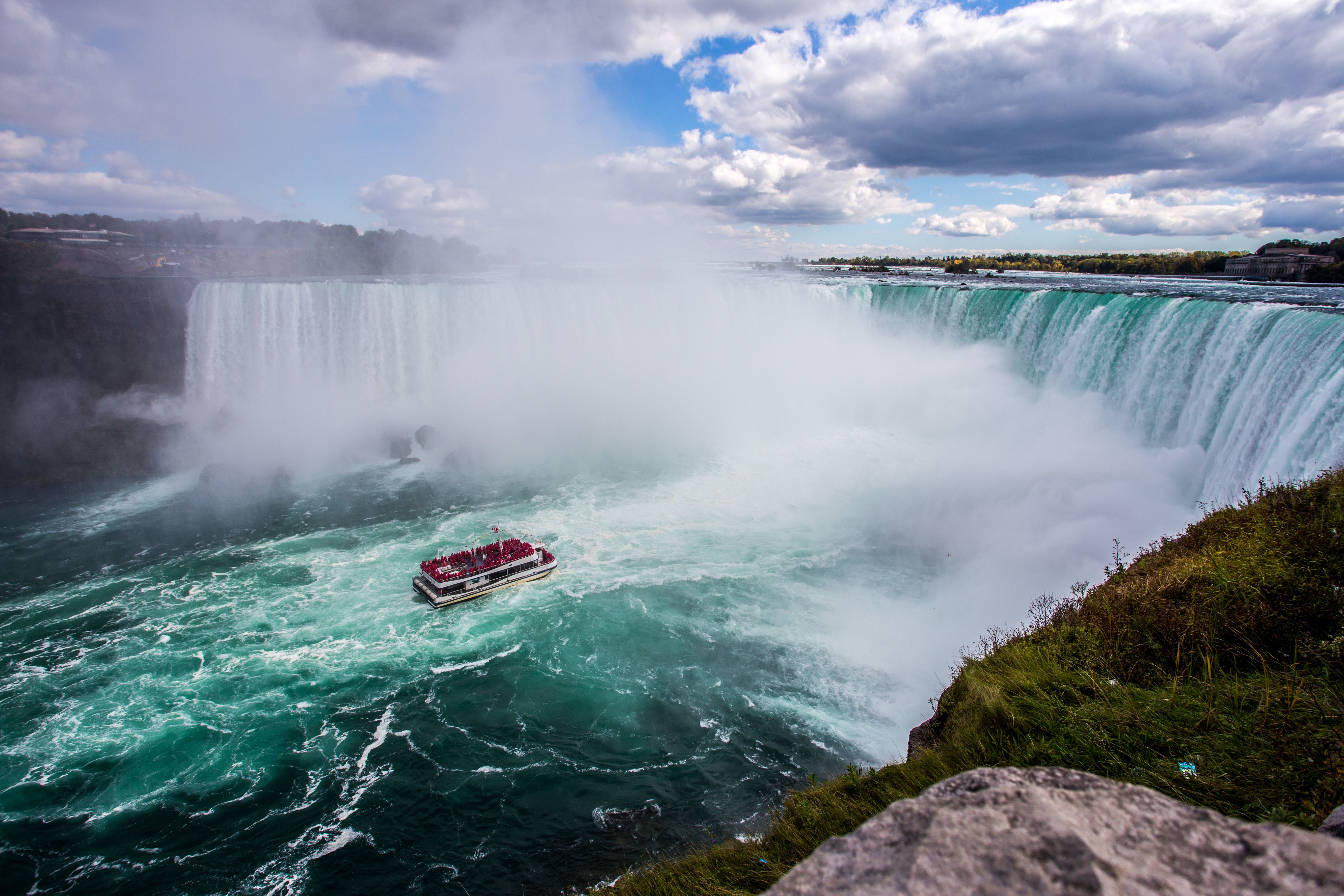 Free photo A ship at the foot of the falls