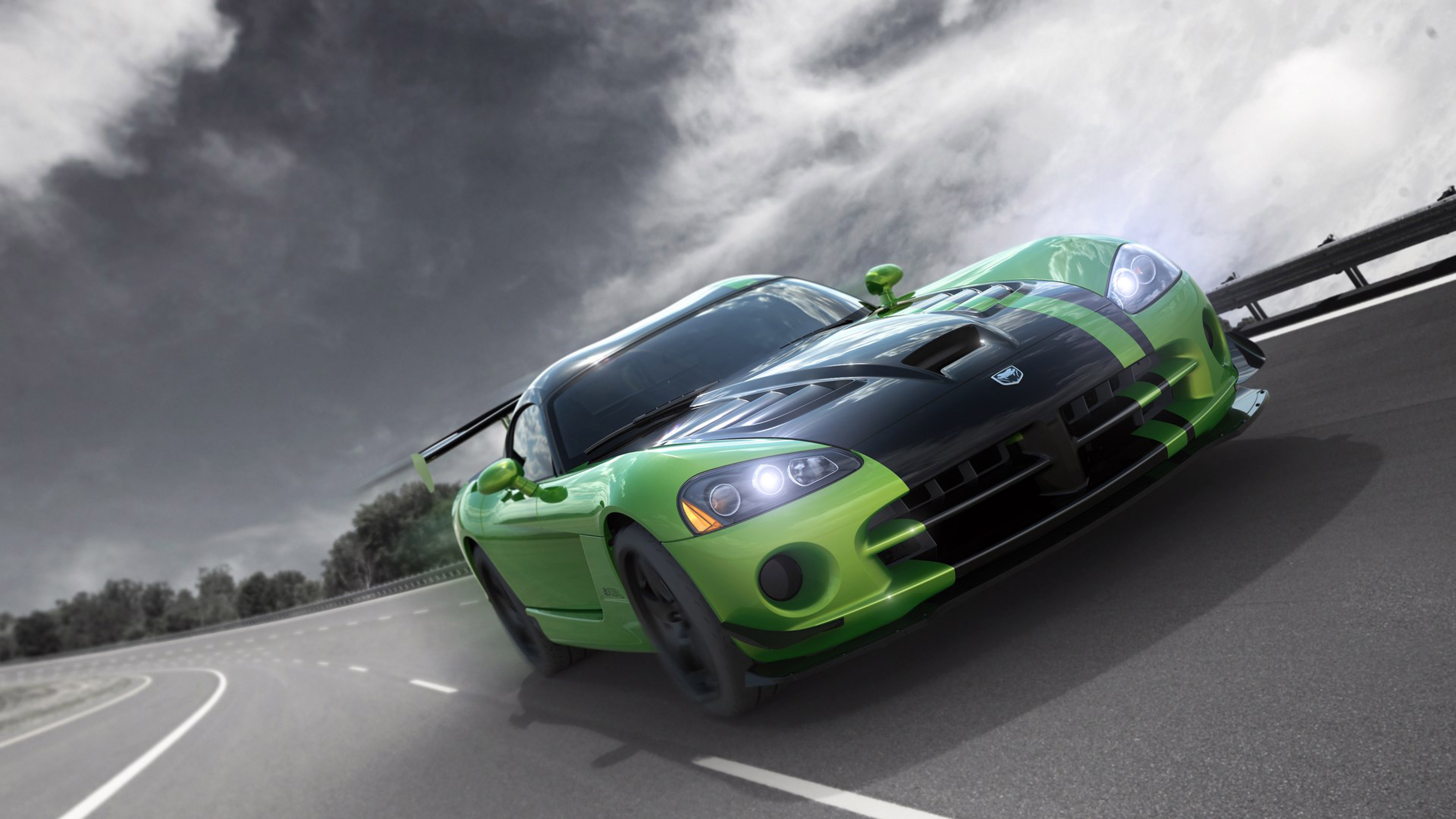 Green Dodge Viper driving on the road