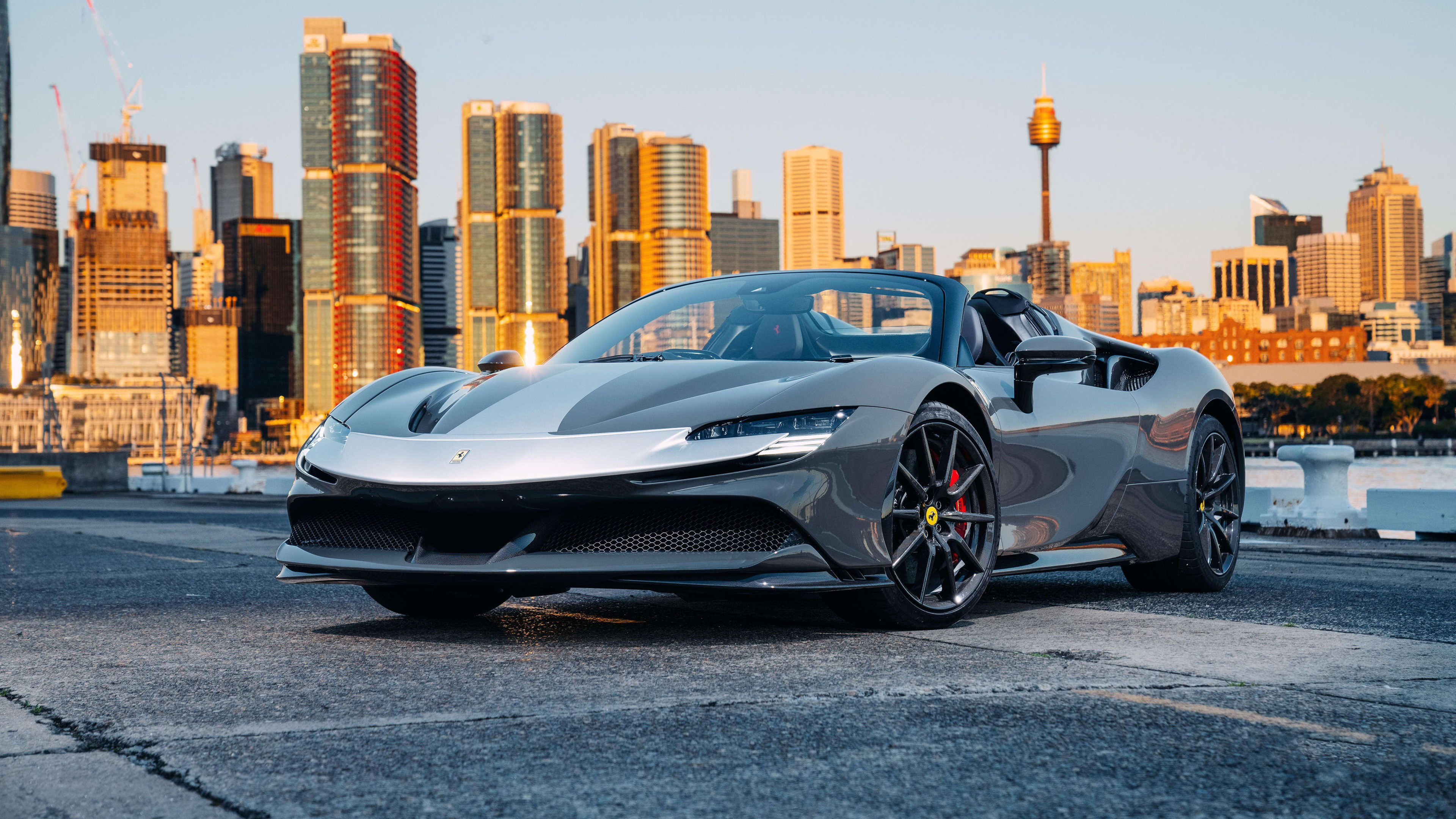 Free photo Ferrari sf90 spider assetto fiorano in front of the city