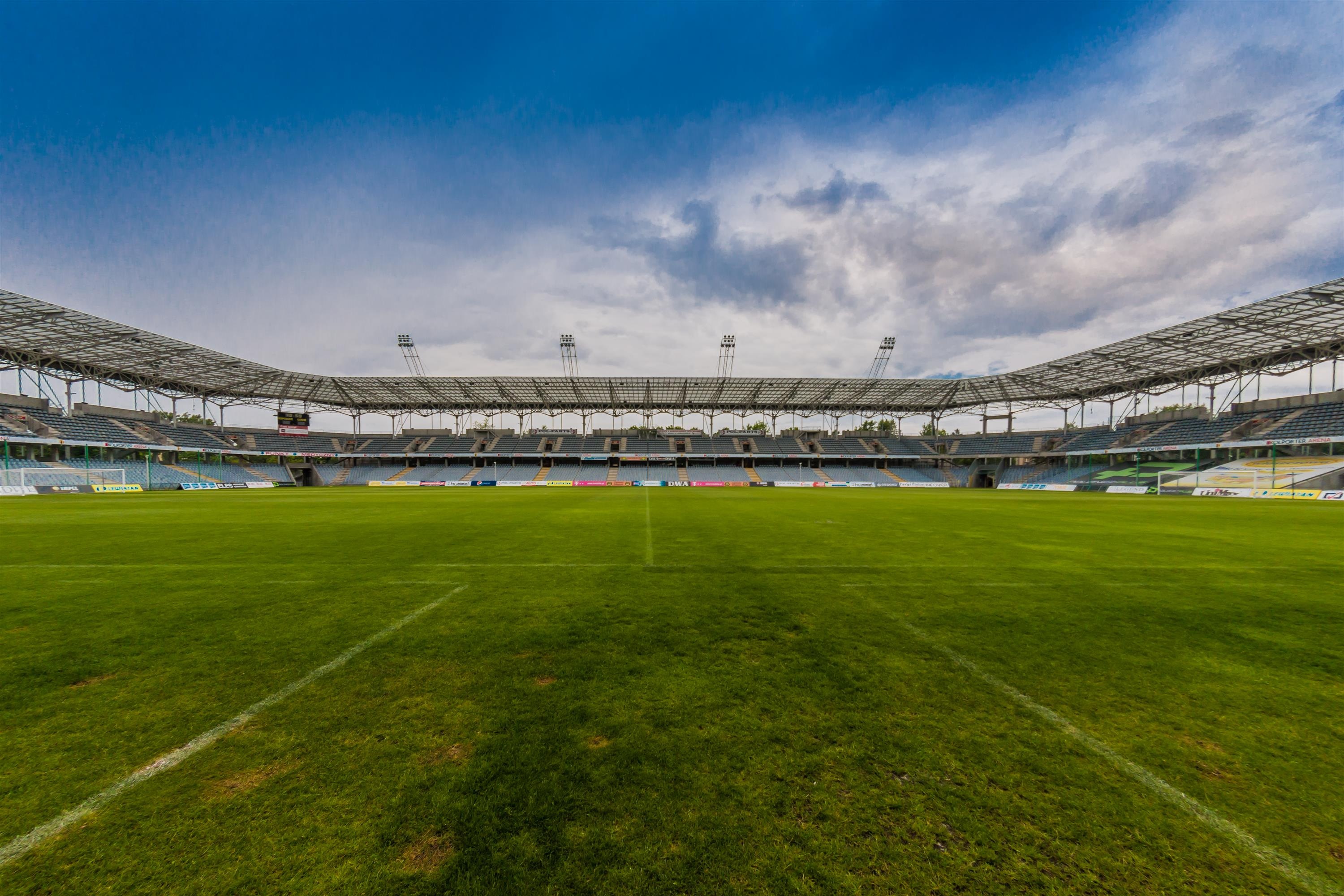 Free photo Large soccer field with a green lawn