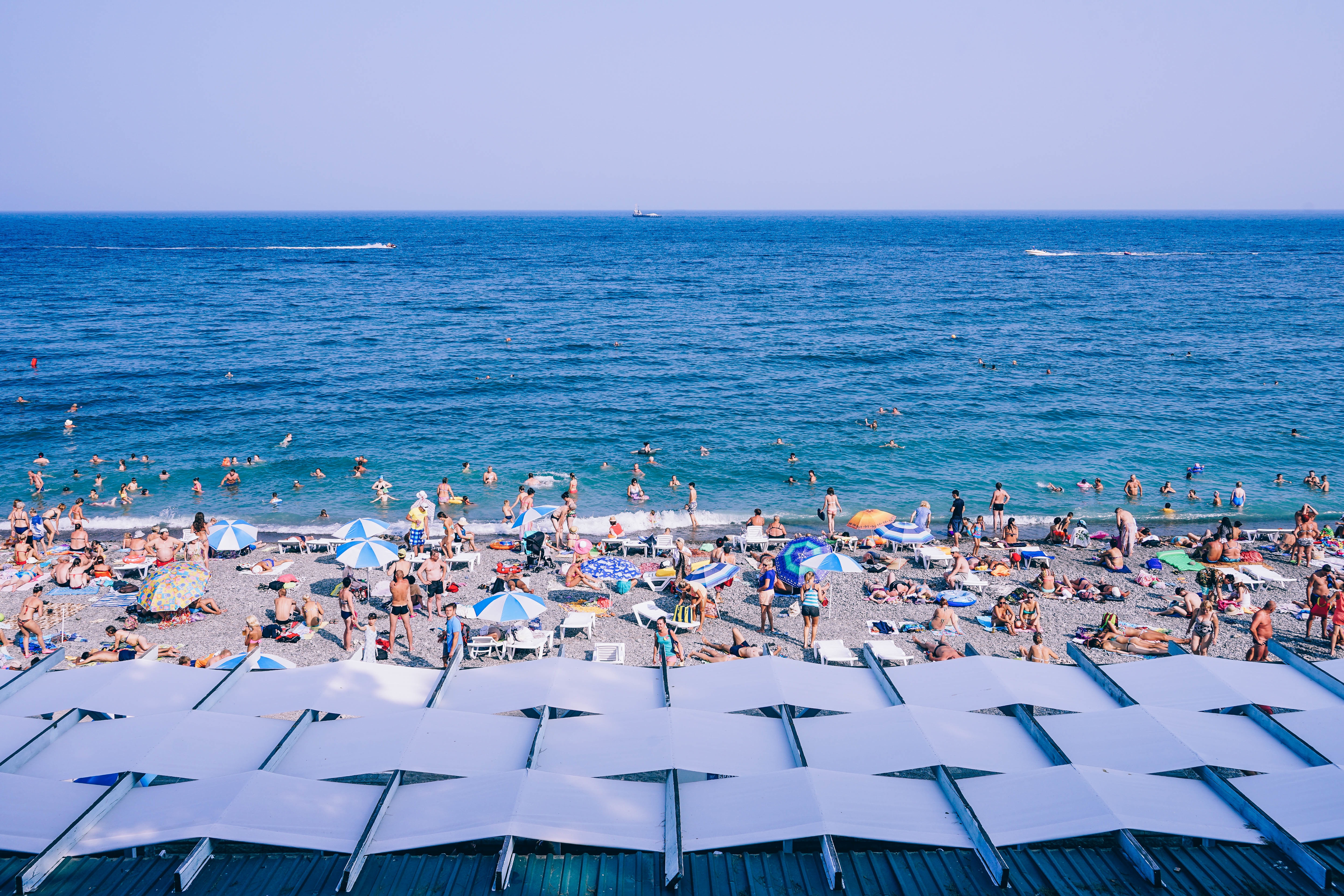 Free photo People vacationing on the beach sea