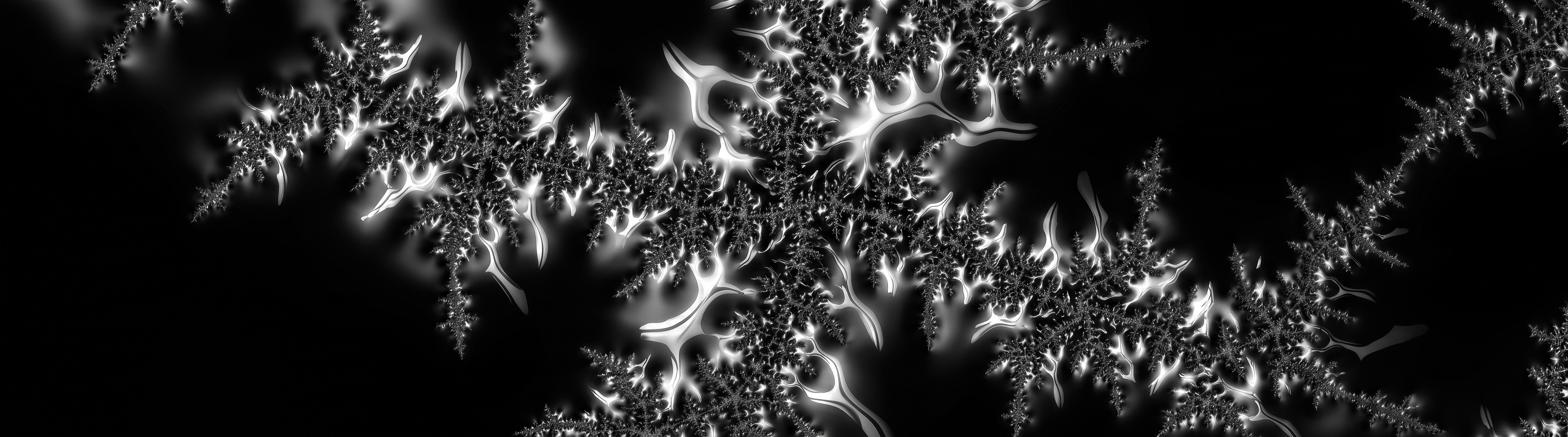 免费照片对比黑白Mandelbrot分形与详细的图案和霓虹灯辉光。