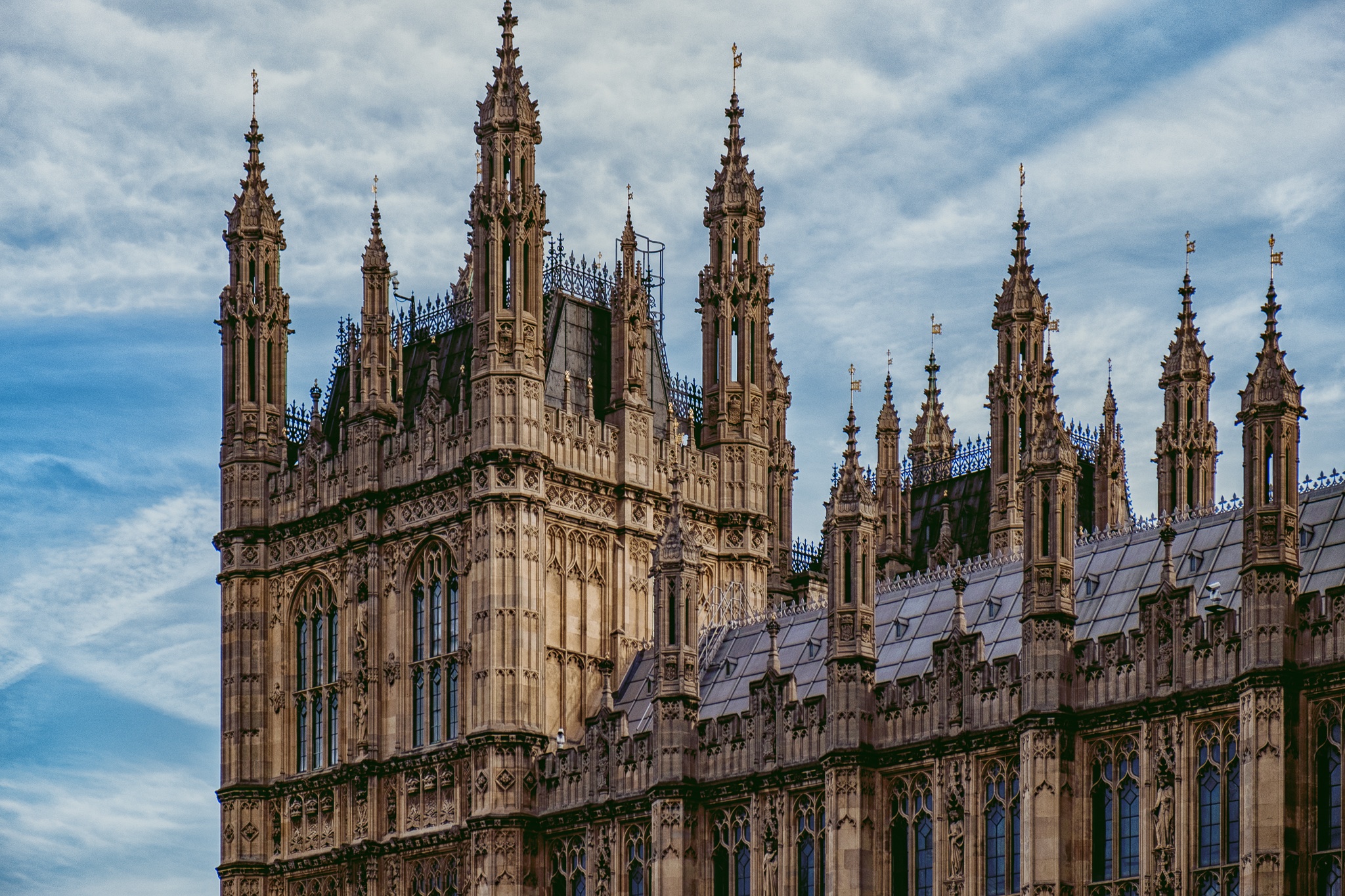 Free photo The facade of a house with spires on the roof in London