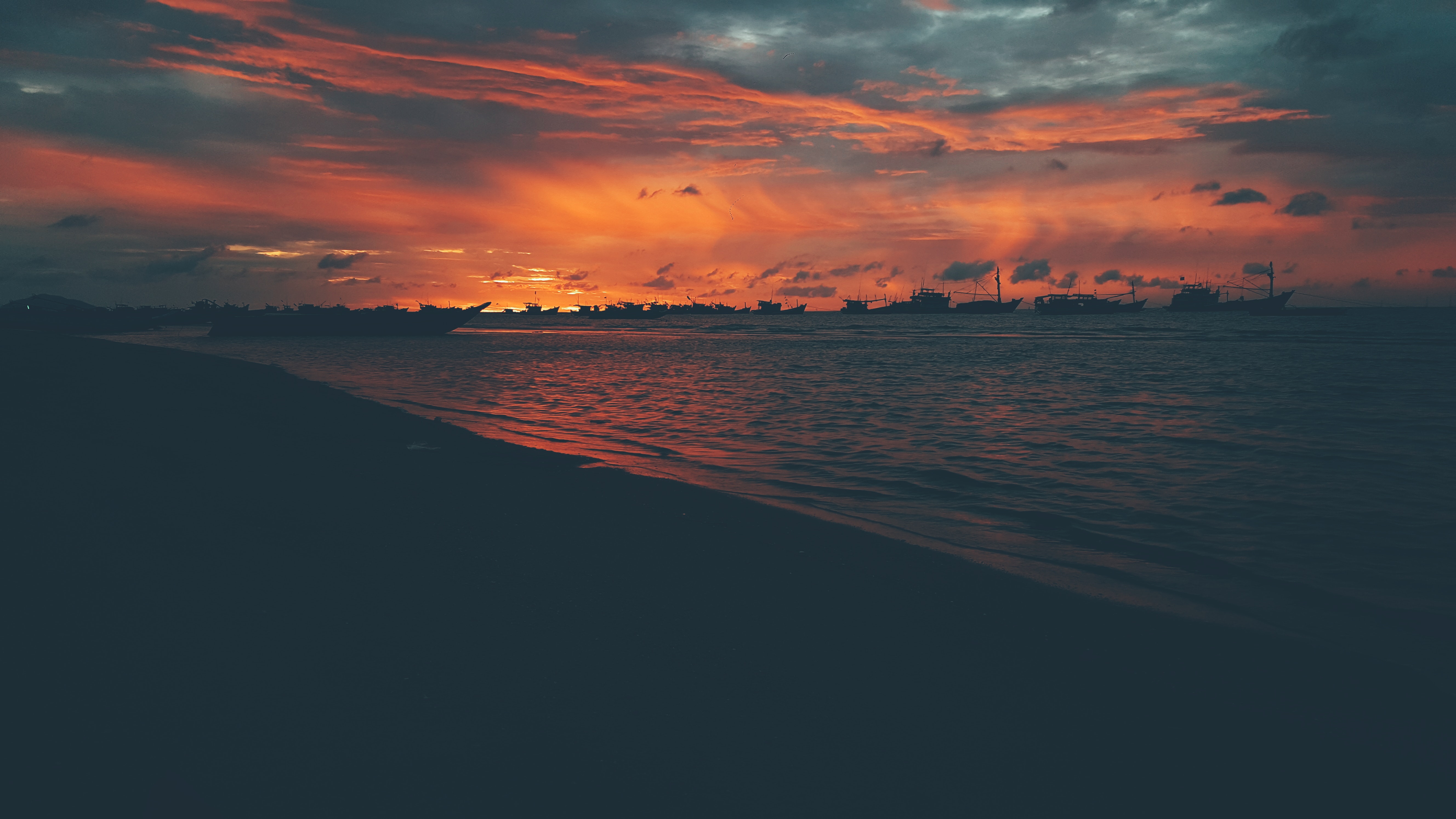 Free photo Night landscape with silhouettes of ships
