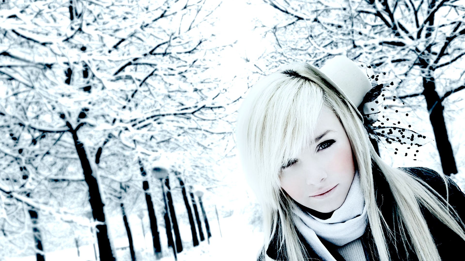 A blonde girl in a winter park.