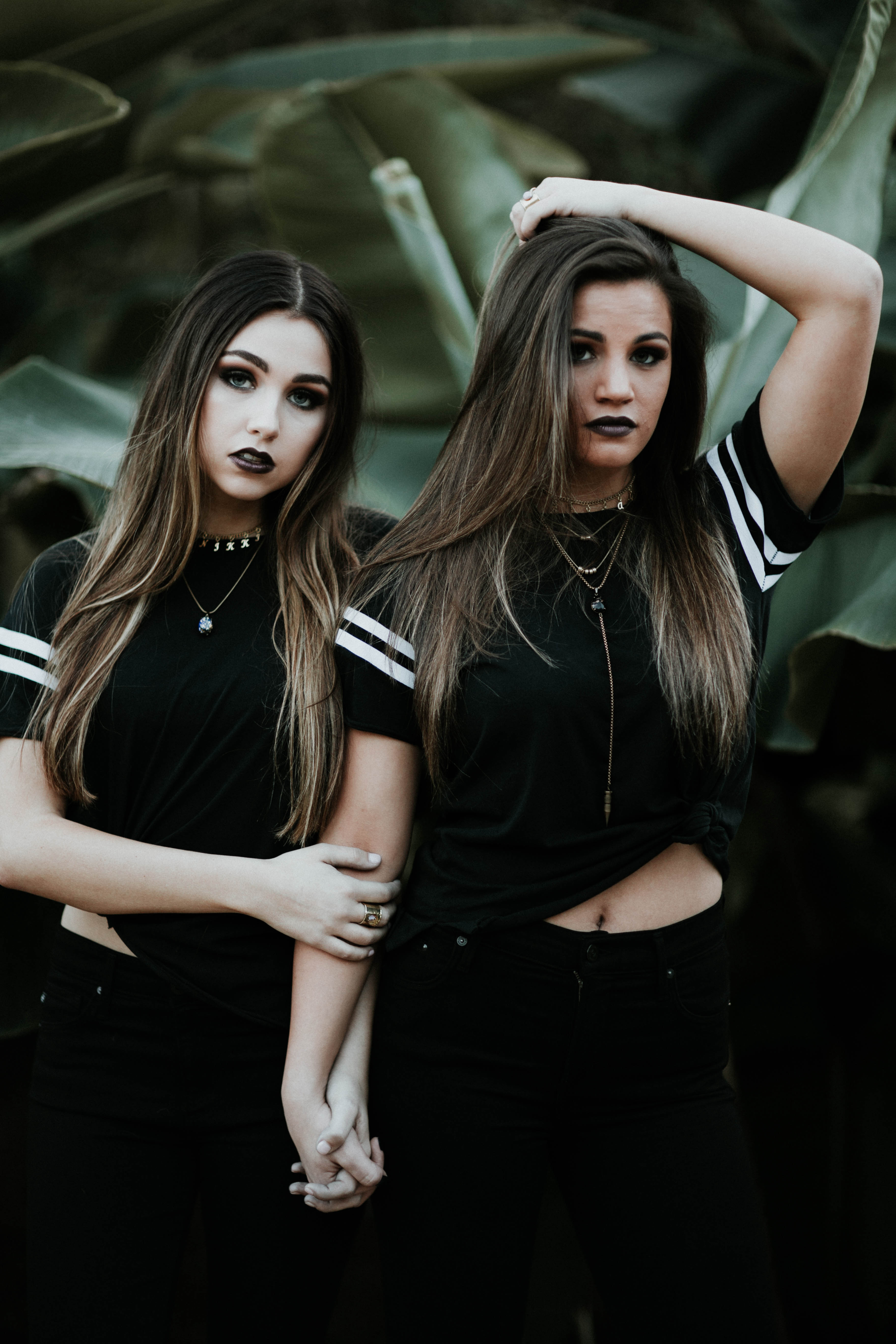 Free photo Two dark-haired girls in matching clothes