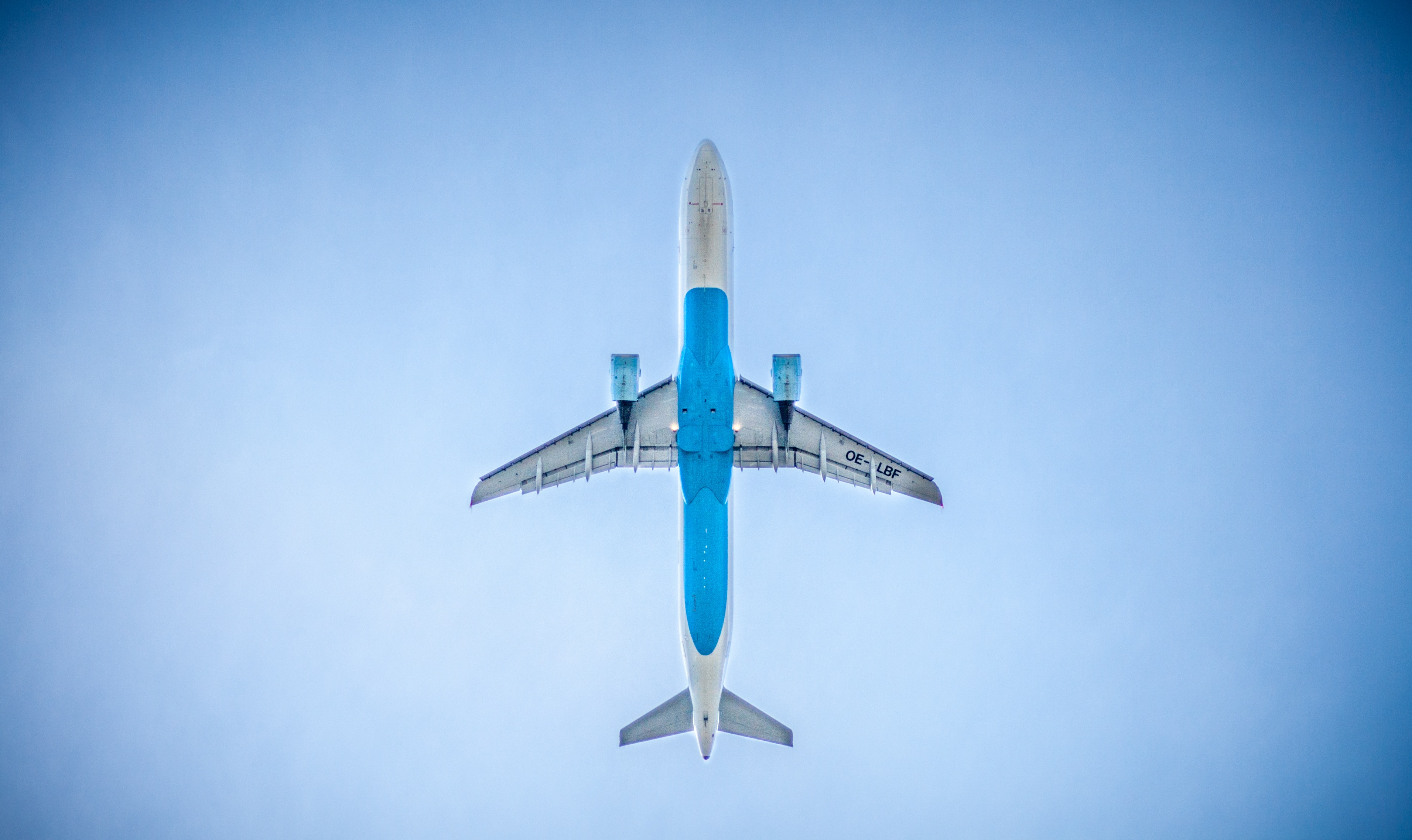 Free photo Airplane in the sky bottom view