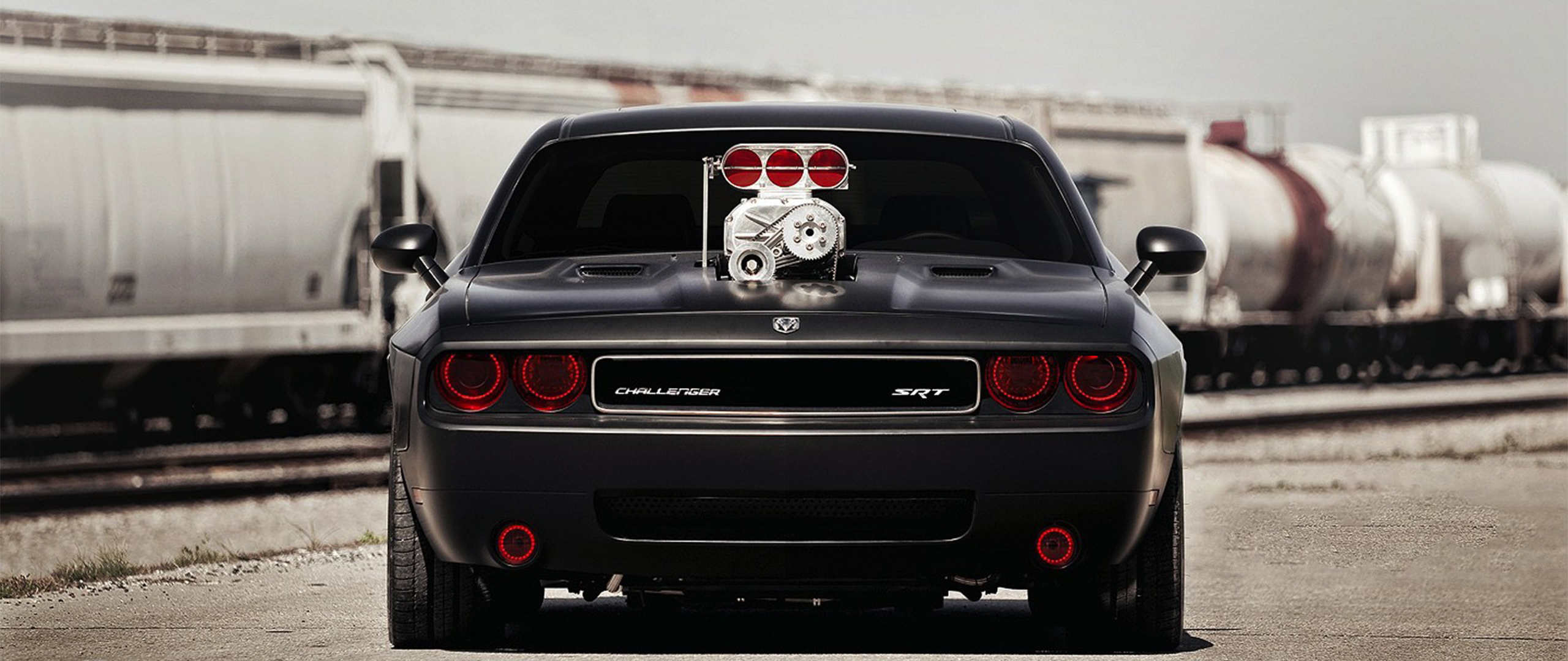 Free photo Dodge Challenger Hellcat with red angel eyes.