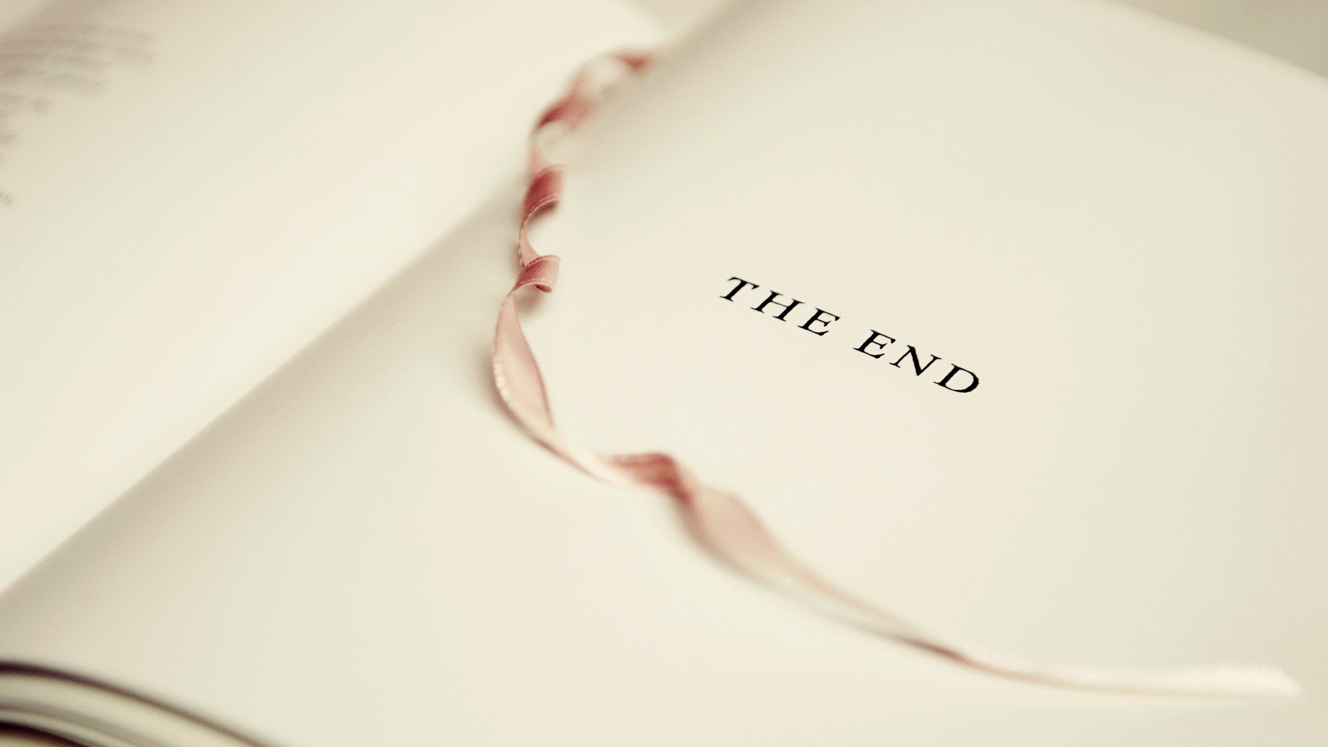 Free photo On the white page of the book, like the last breath, the words were laid: - THE END.