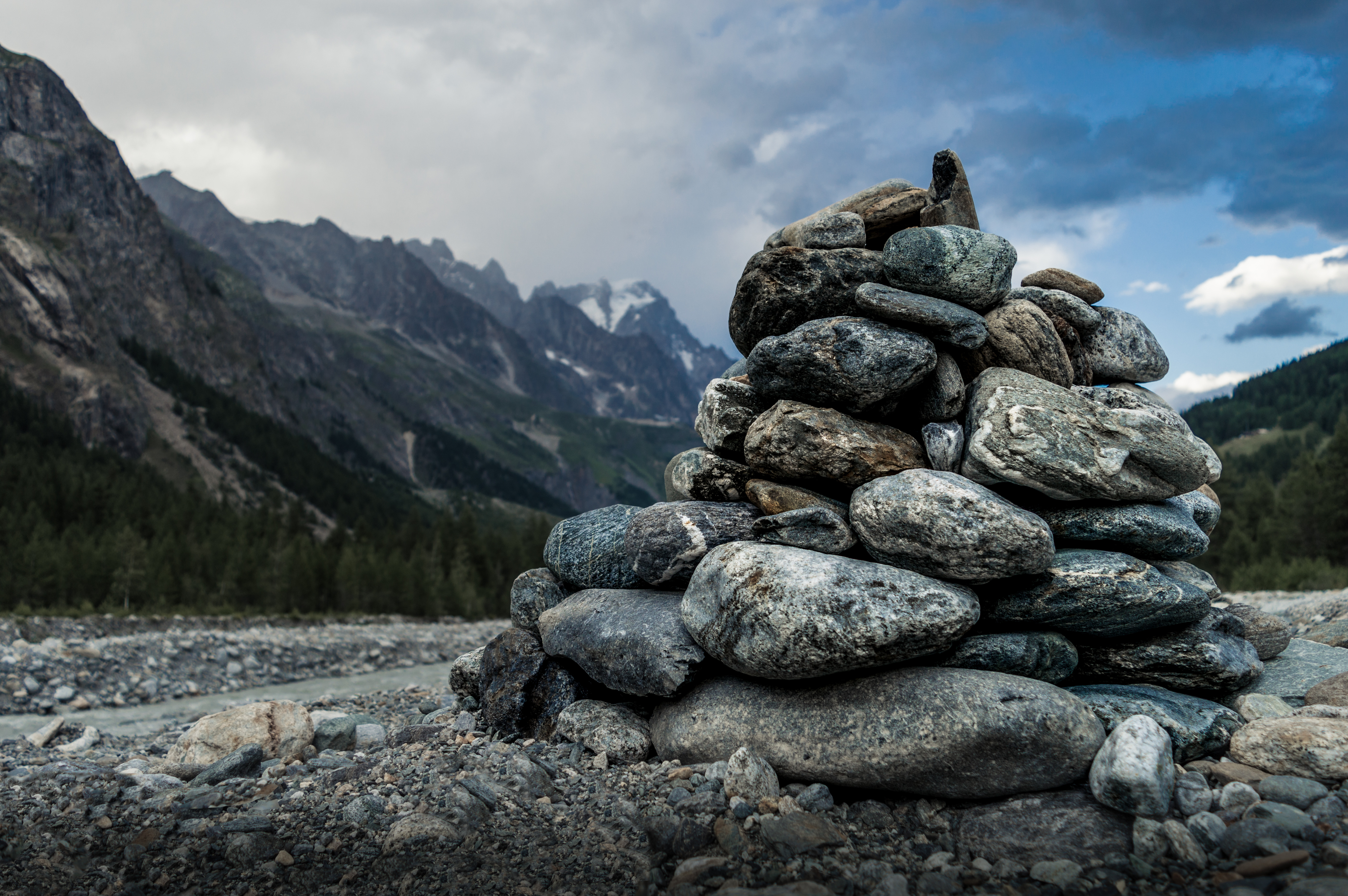 A tower of river stones in a mountainous area