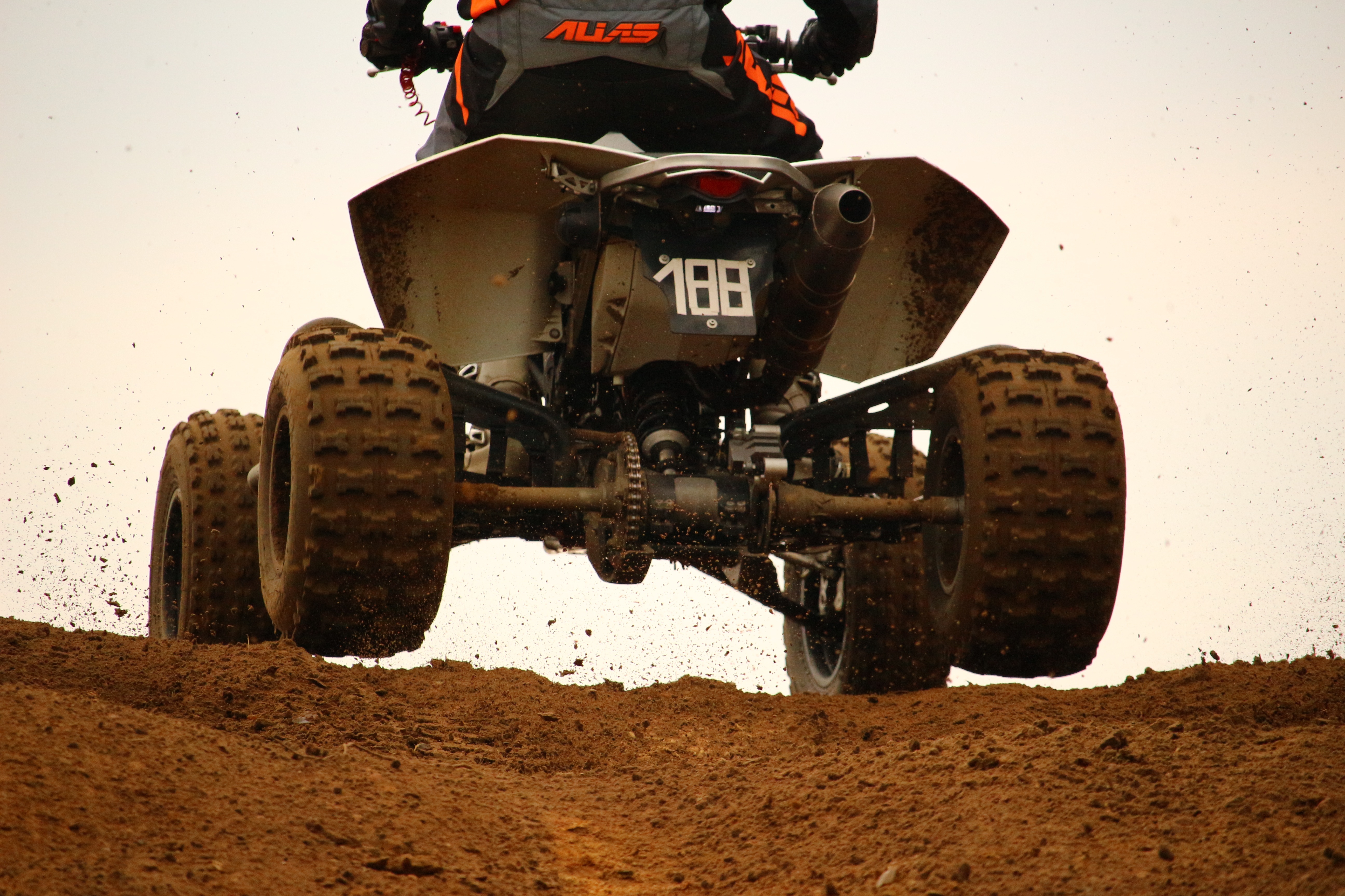 Free photo Riding an ATV in the mud