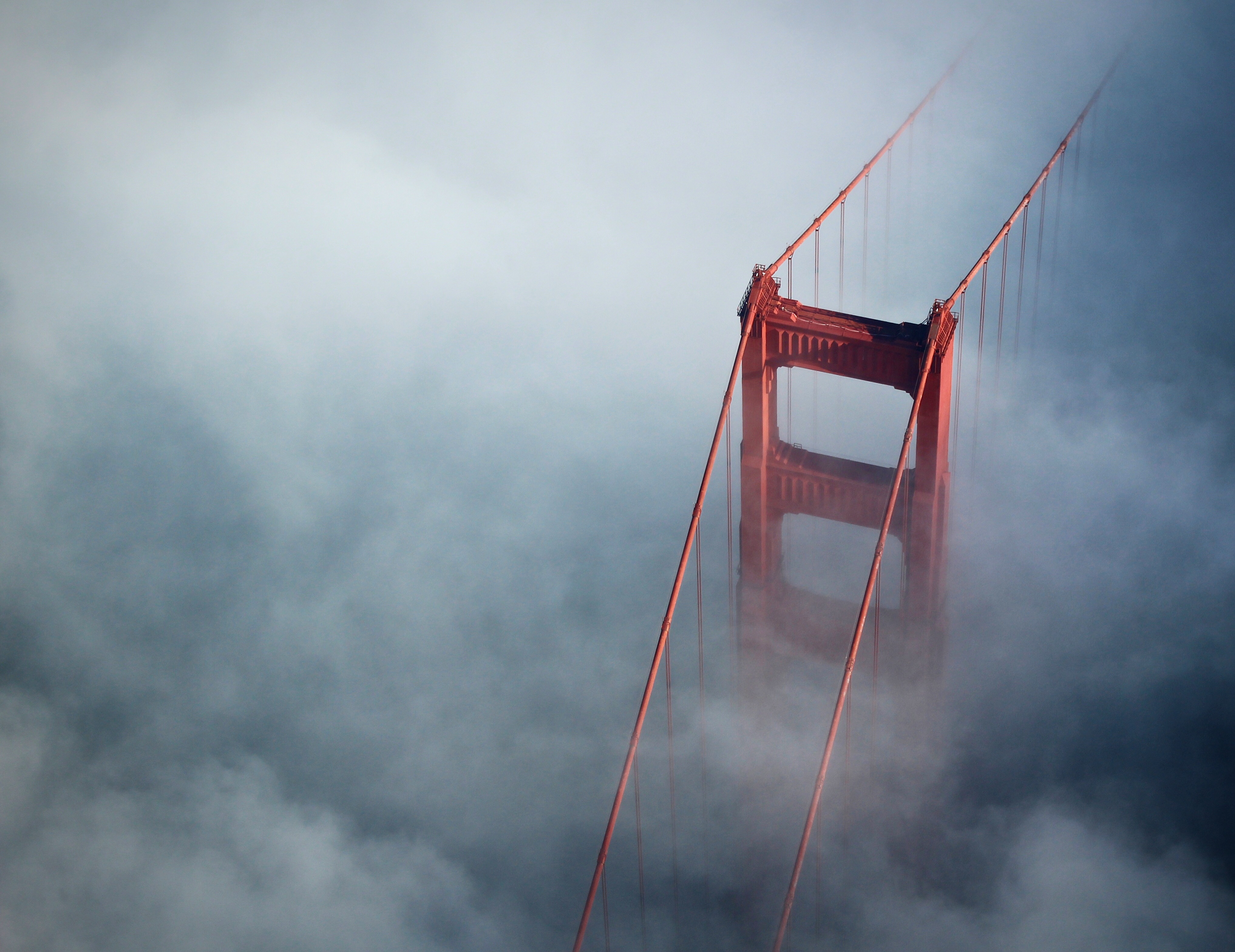 The golden gate bridge in the thick clouds