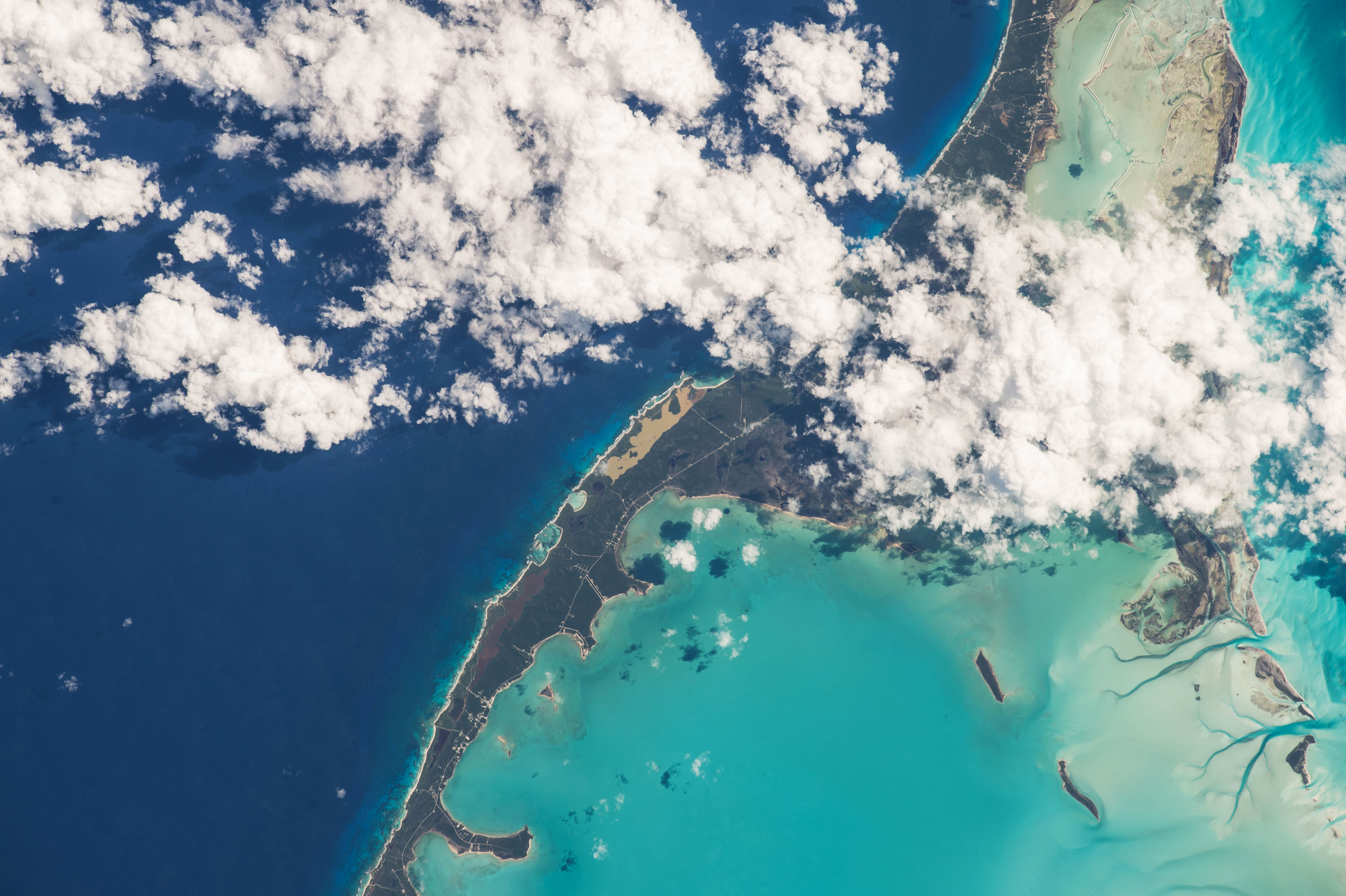 Free photo View from space of an island surrounded by different seas