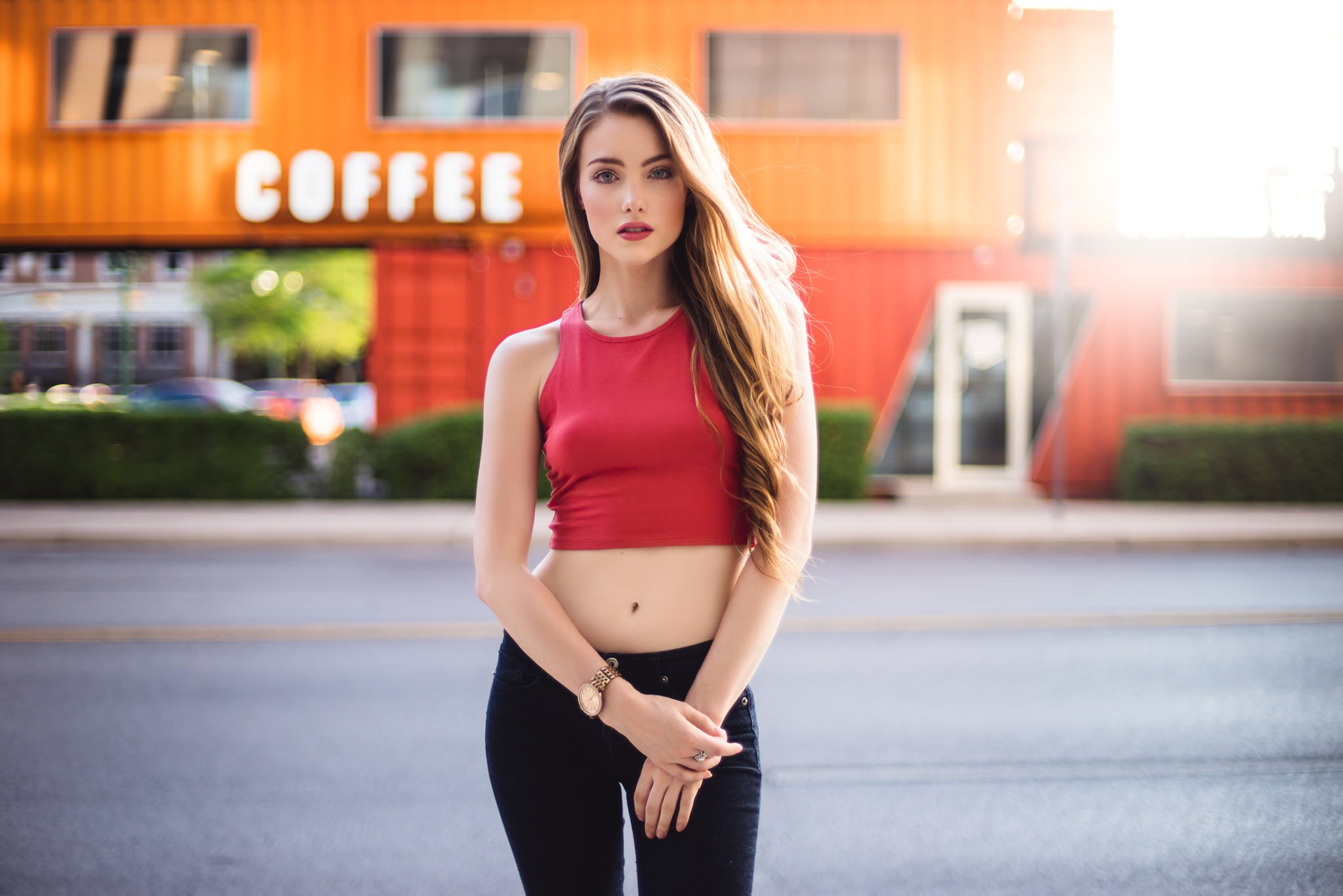 Free photo April Alleys in a red bra-less top in sunny weather