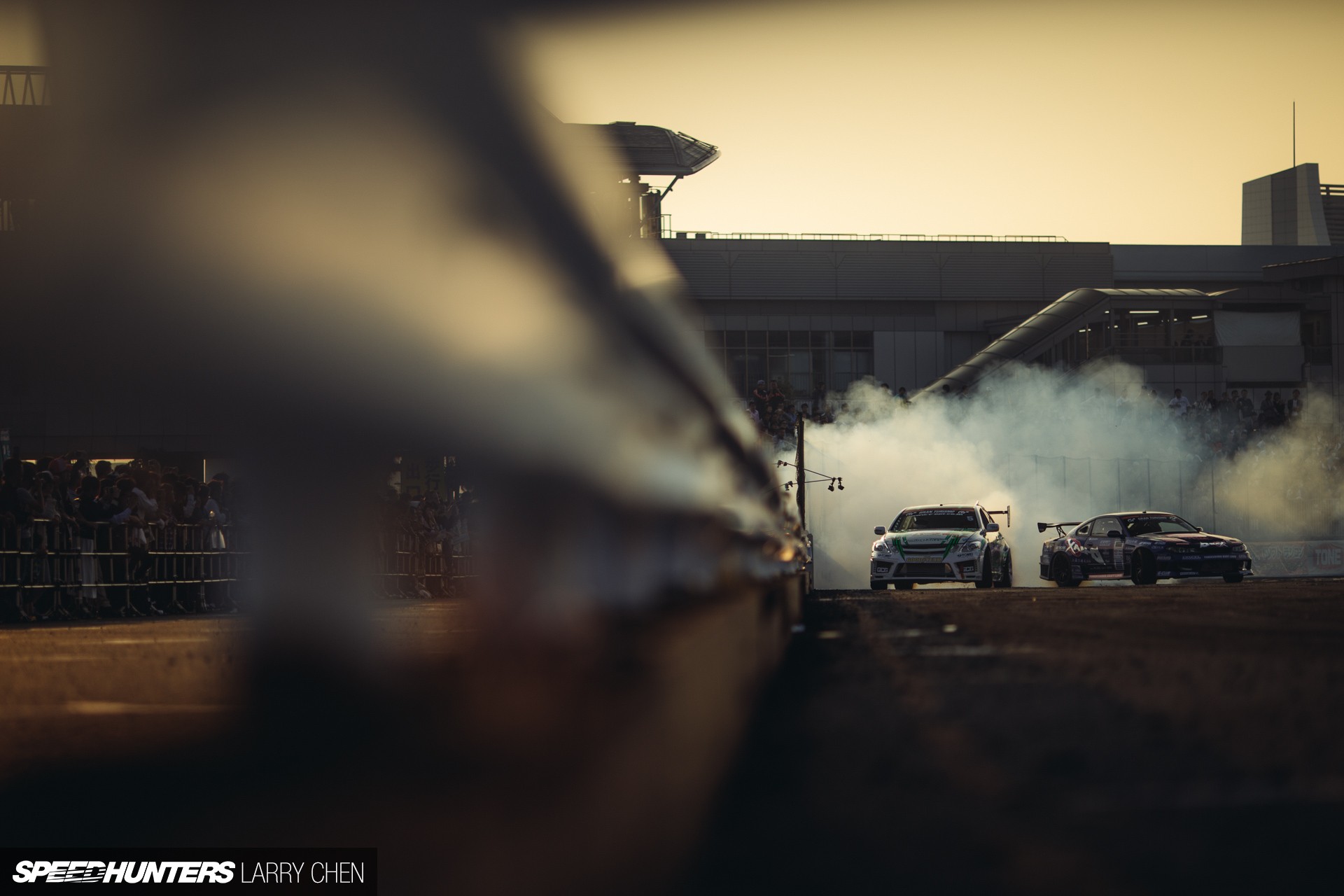 Free photo Pair drifting in sports cars.