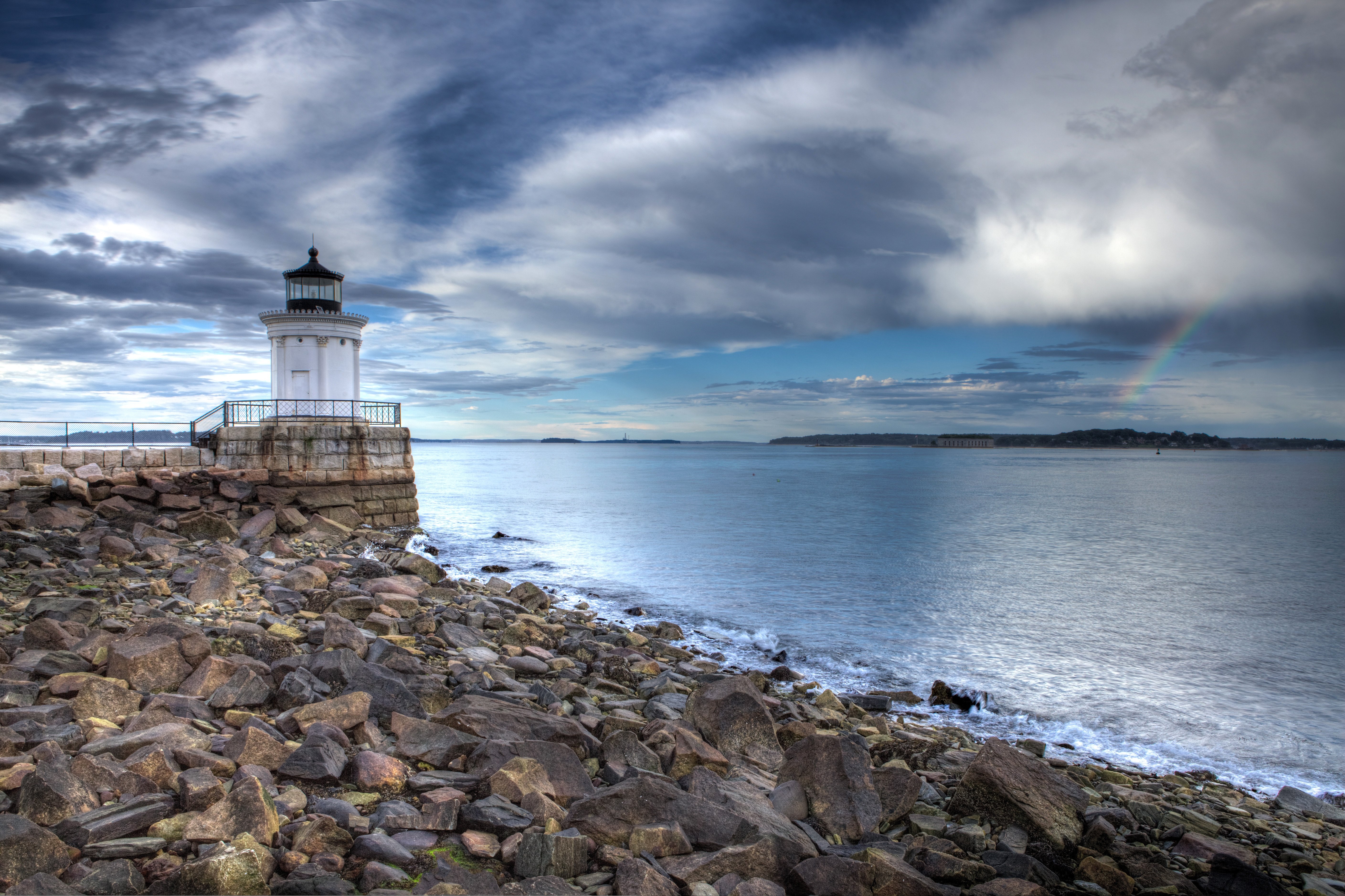 Free photo Lighthouse on a rocky beach