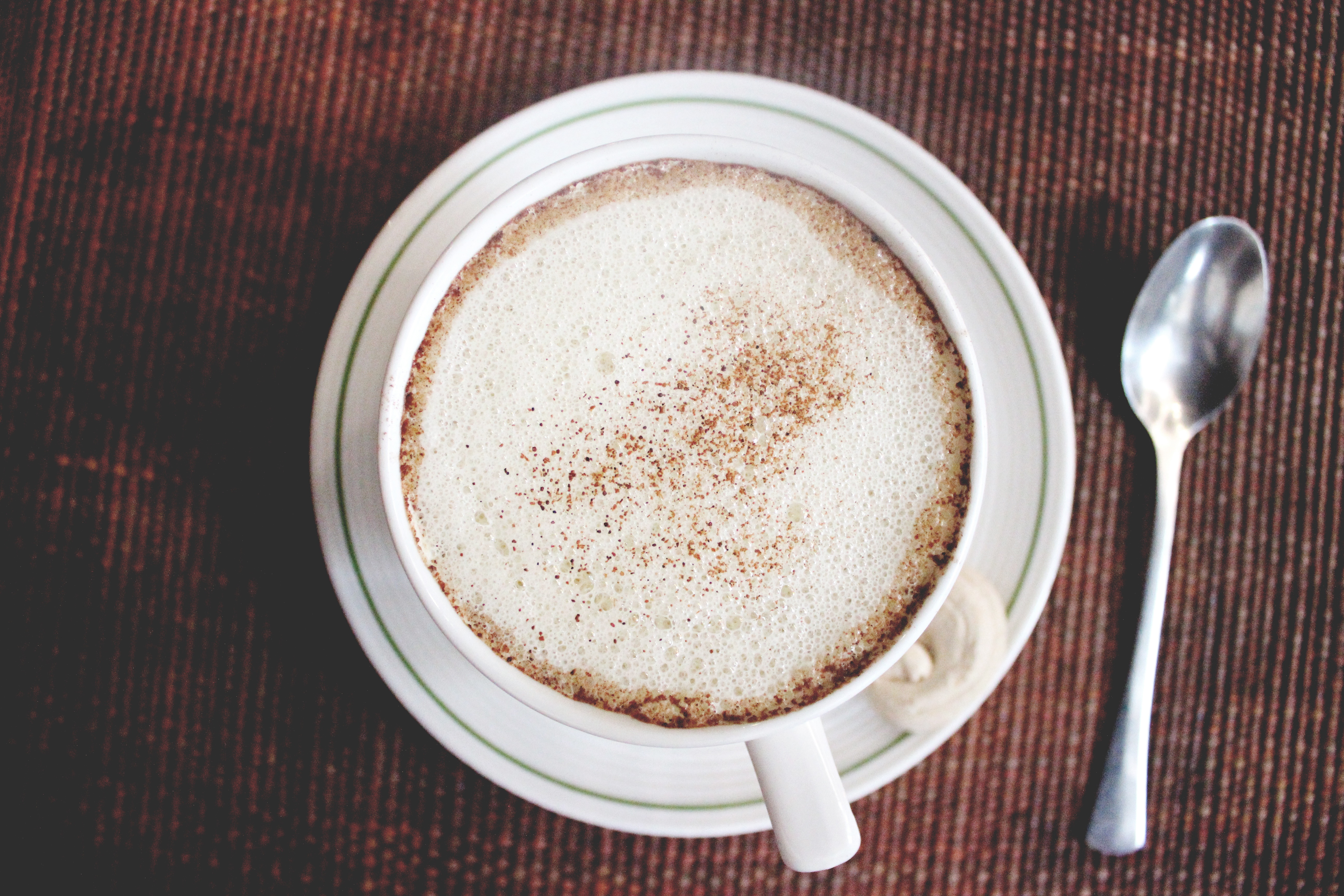 Free photo A white cup of coffee on a white saucer