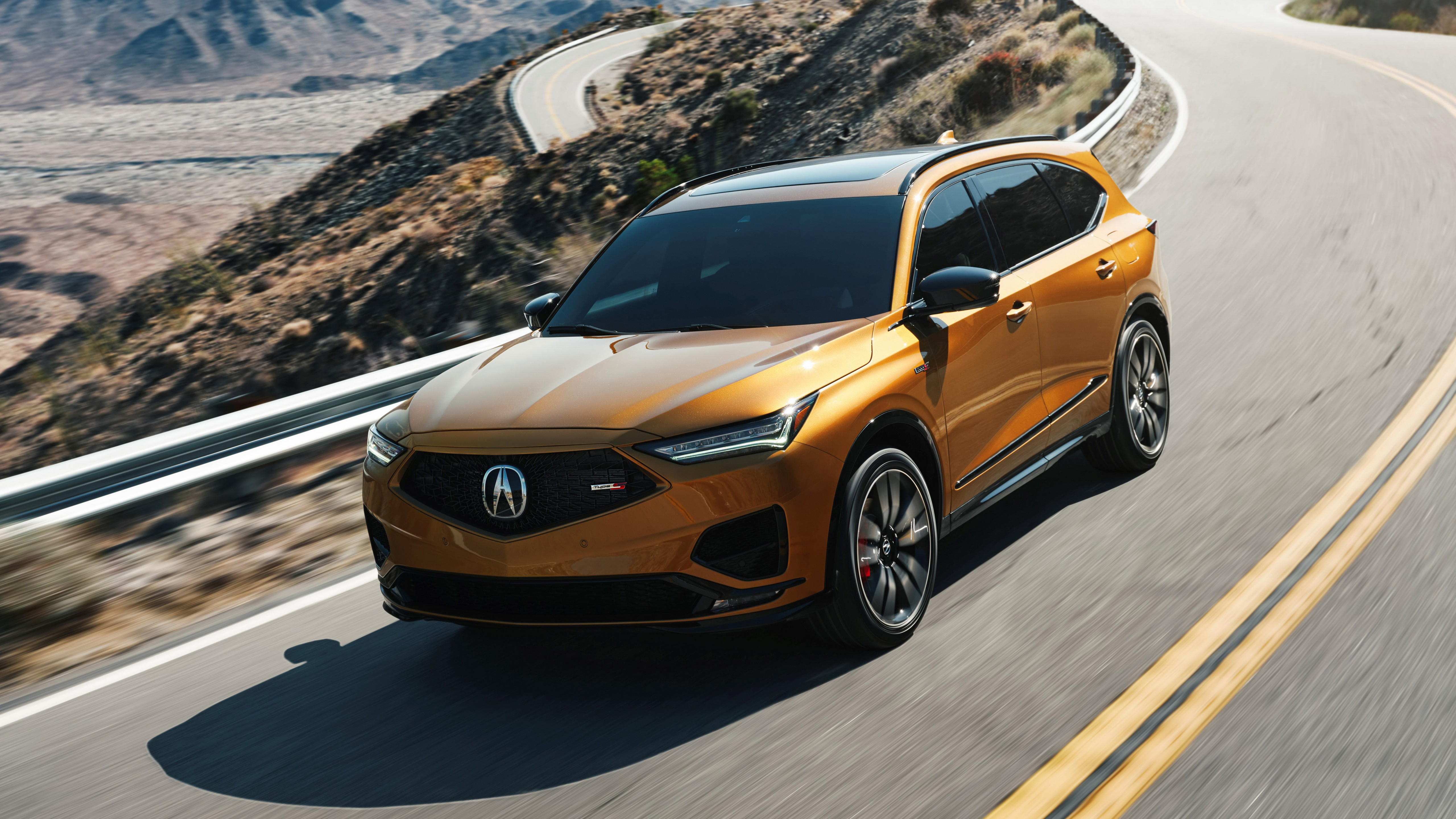 Free photo The acura mdx 2022 SUV drives on a country road