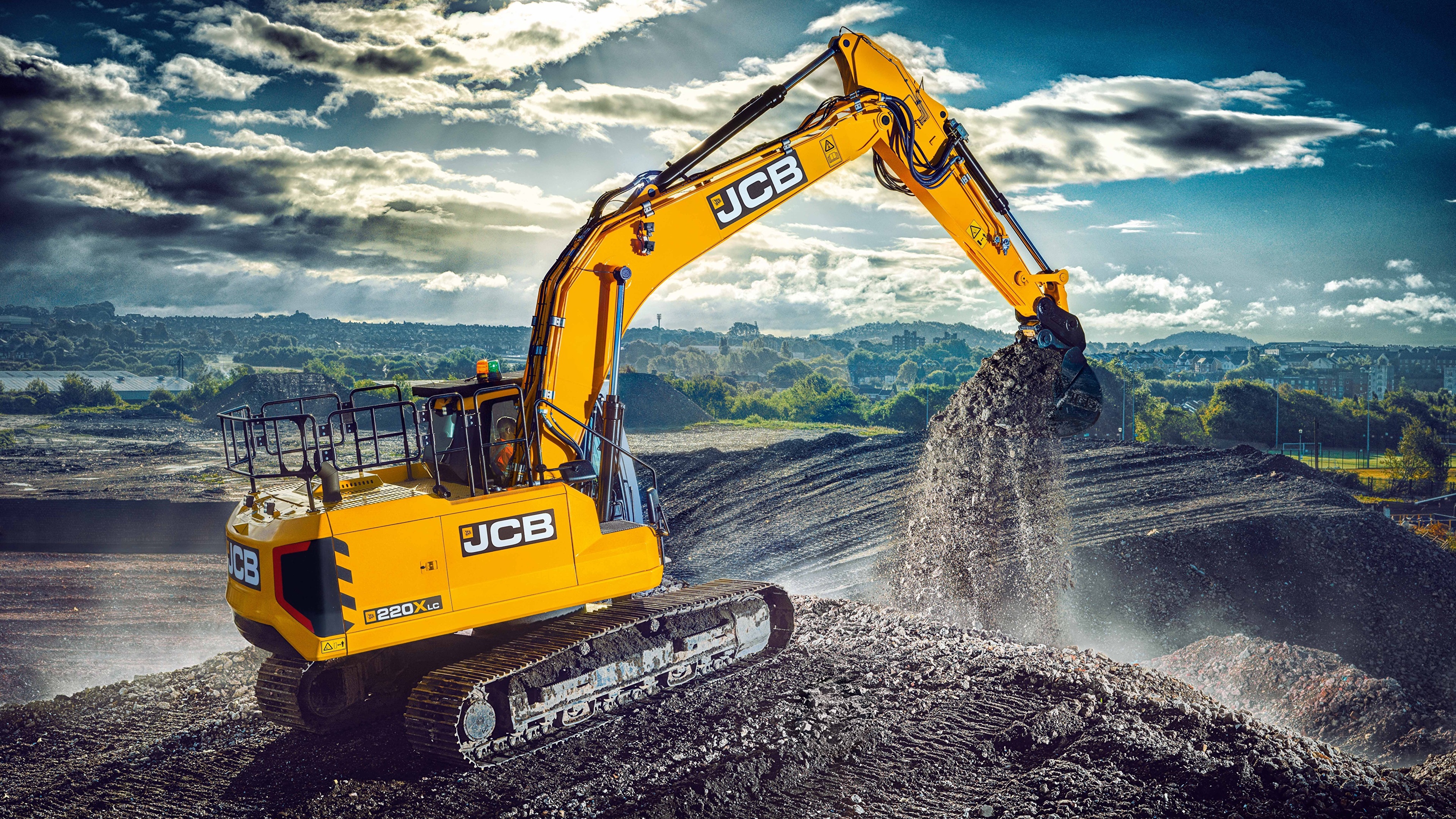 Бесплатное фото Как выглядит экскаватор JCB 220XLC желтого цвета