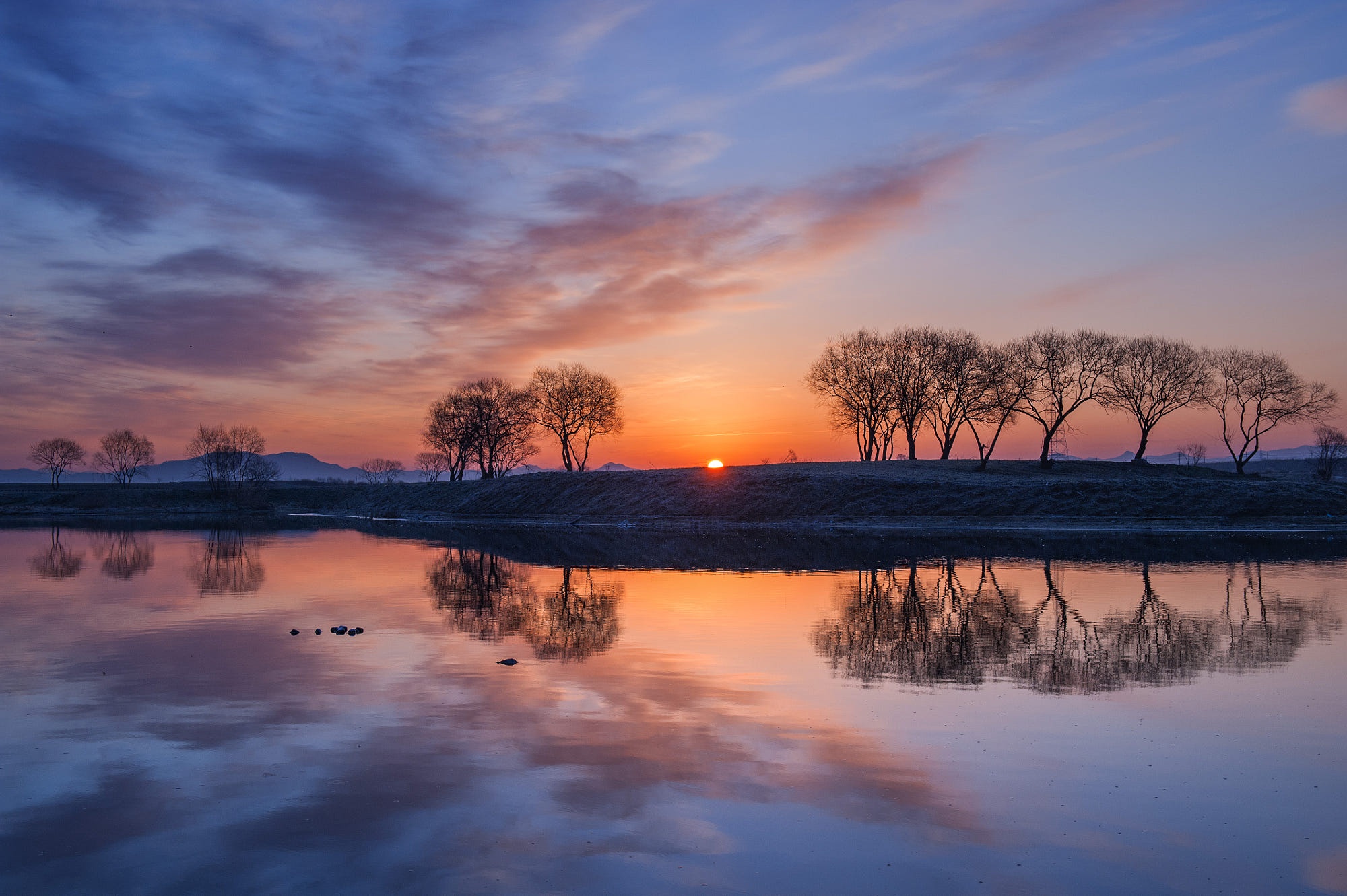 Autumn sunset by the river