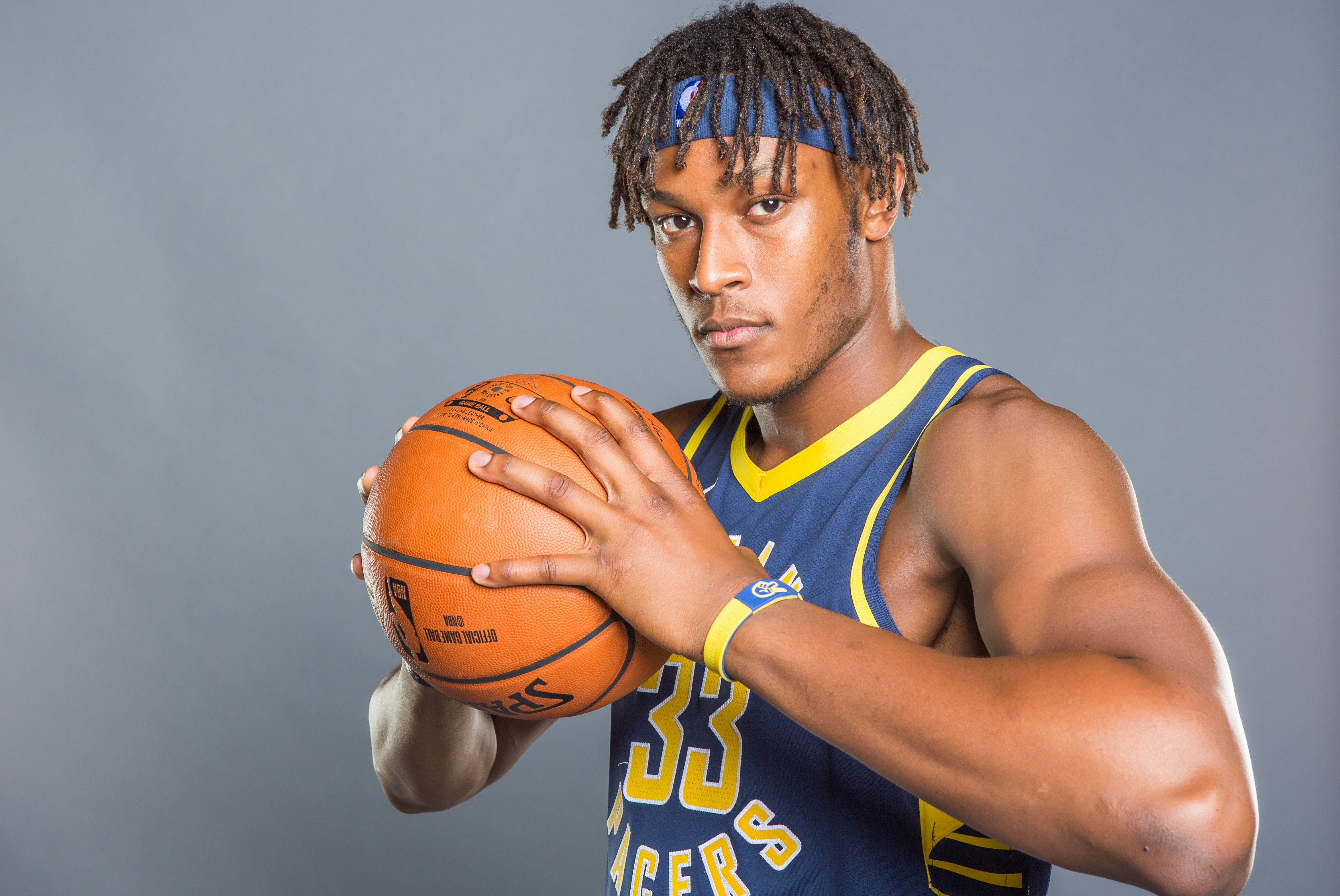 Free photo Basketball player Miles Turner with a ball in his hands