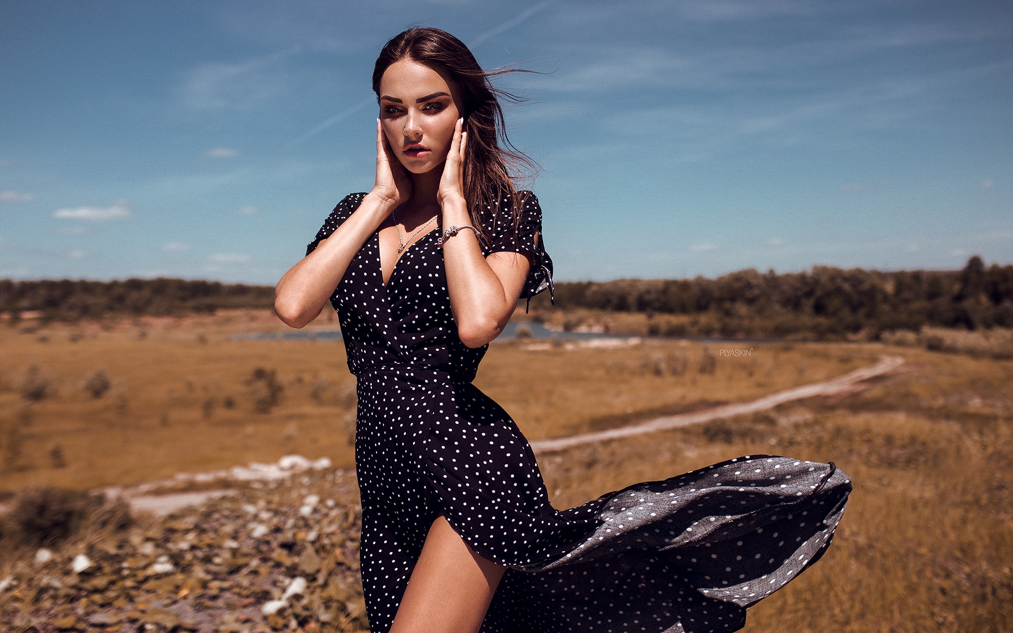 Free photo Beautiful girl in black polka-dot dress