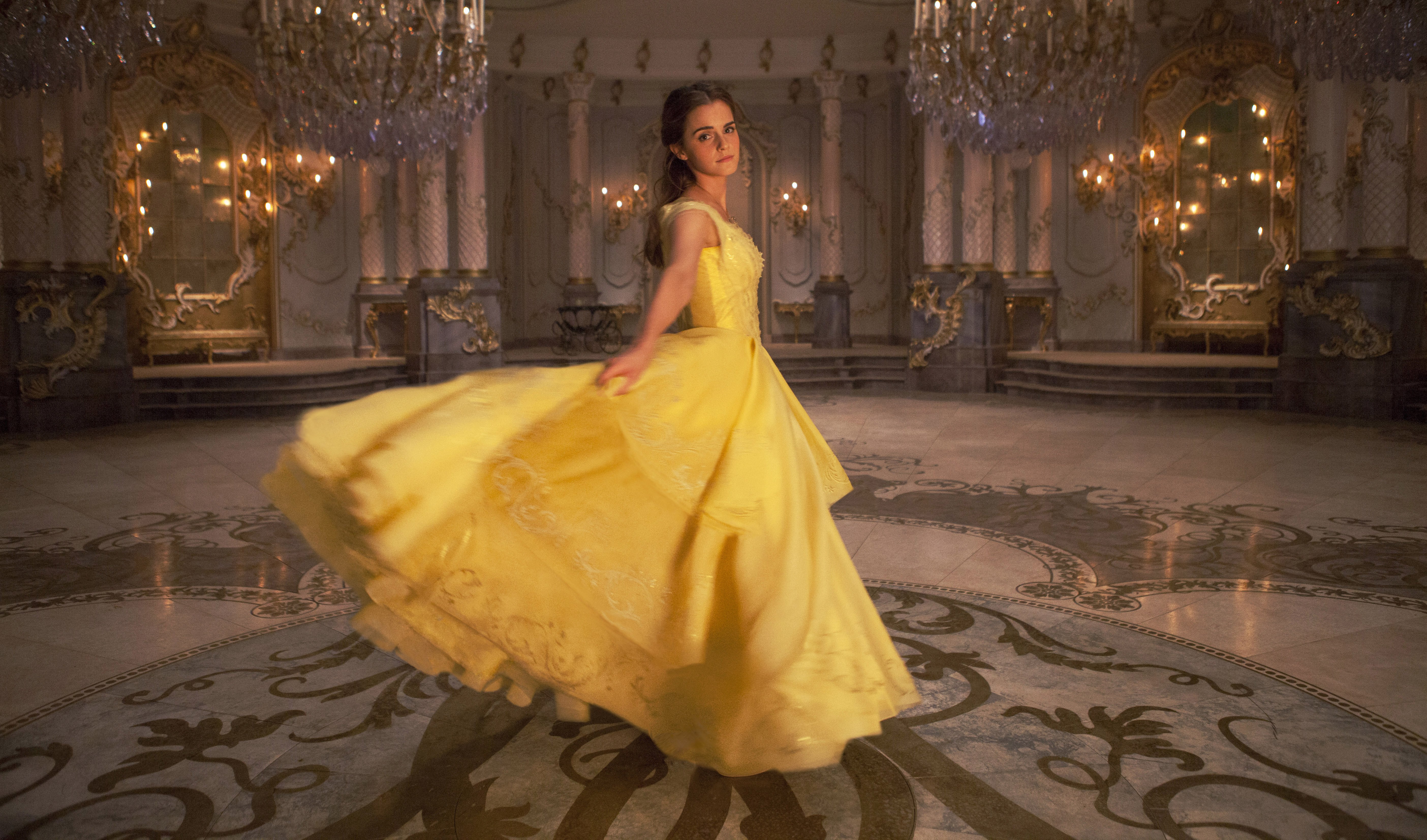 Emma Watson dances in a yellow dress