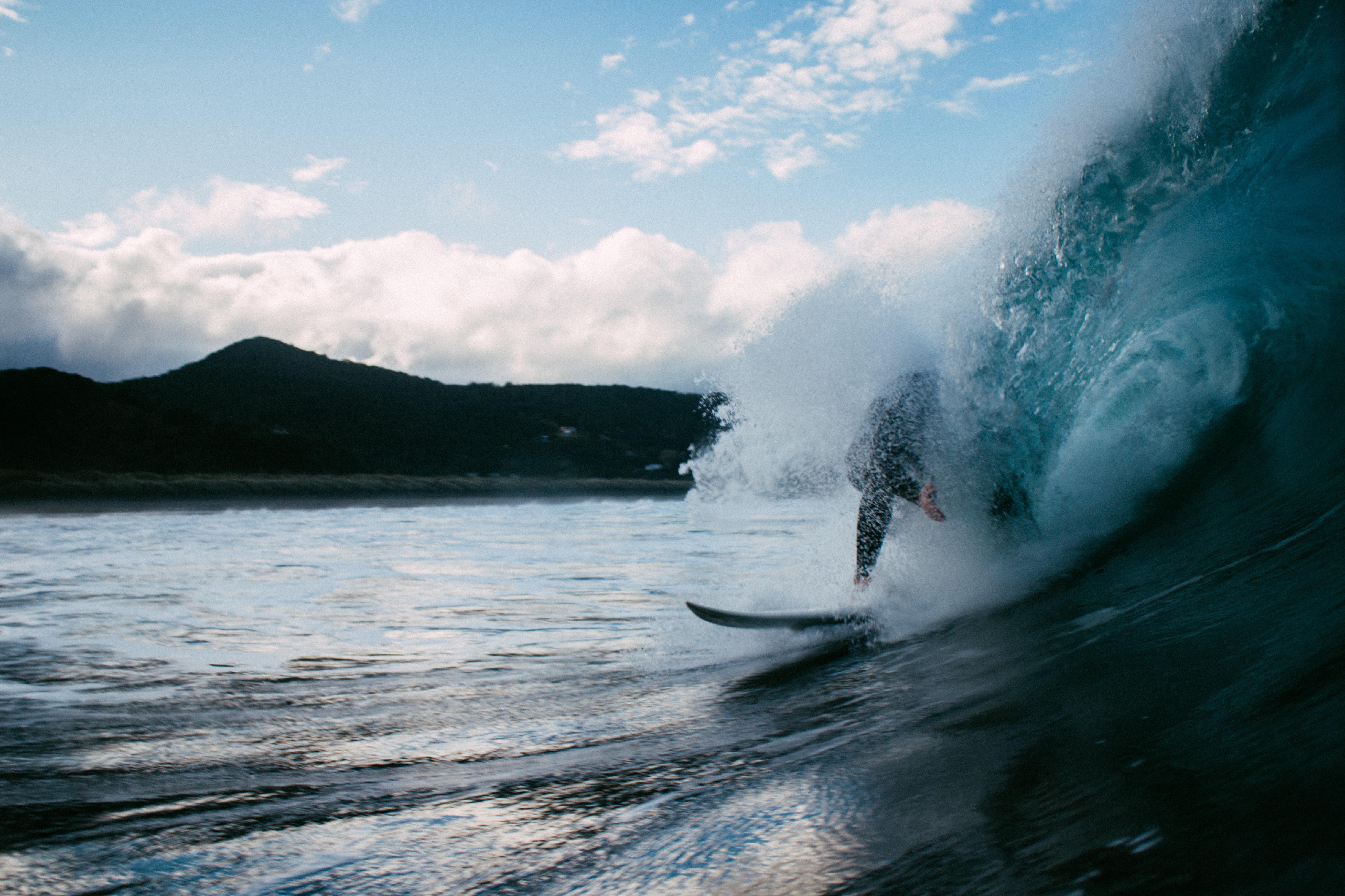 Free photo Surfer under the wave