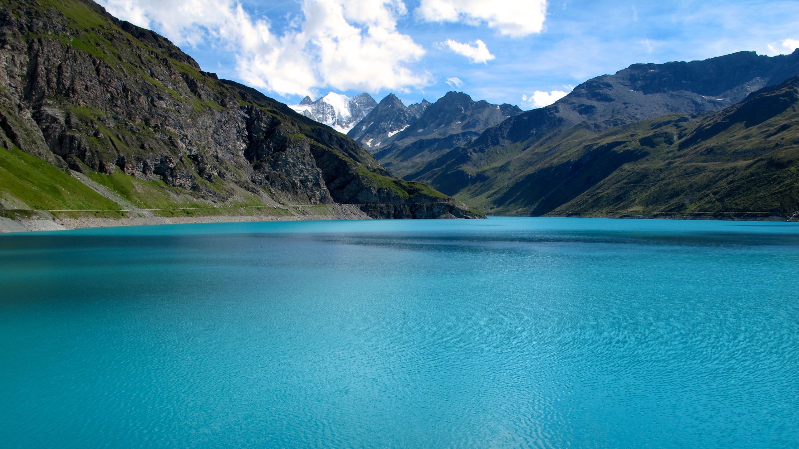 A big lake in the mountains with blue water