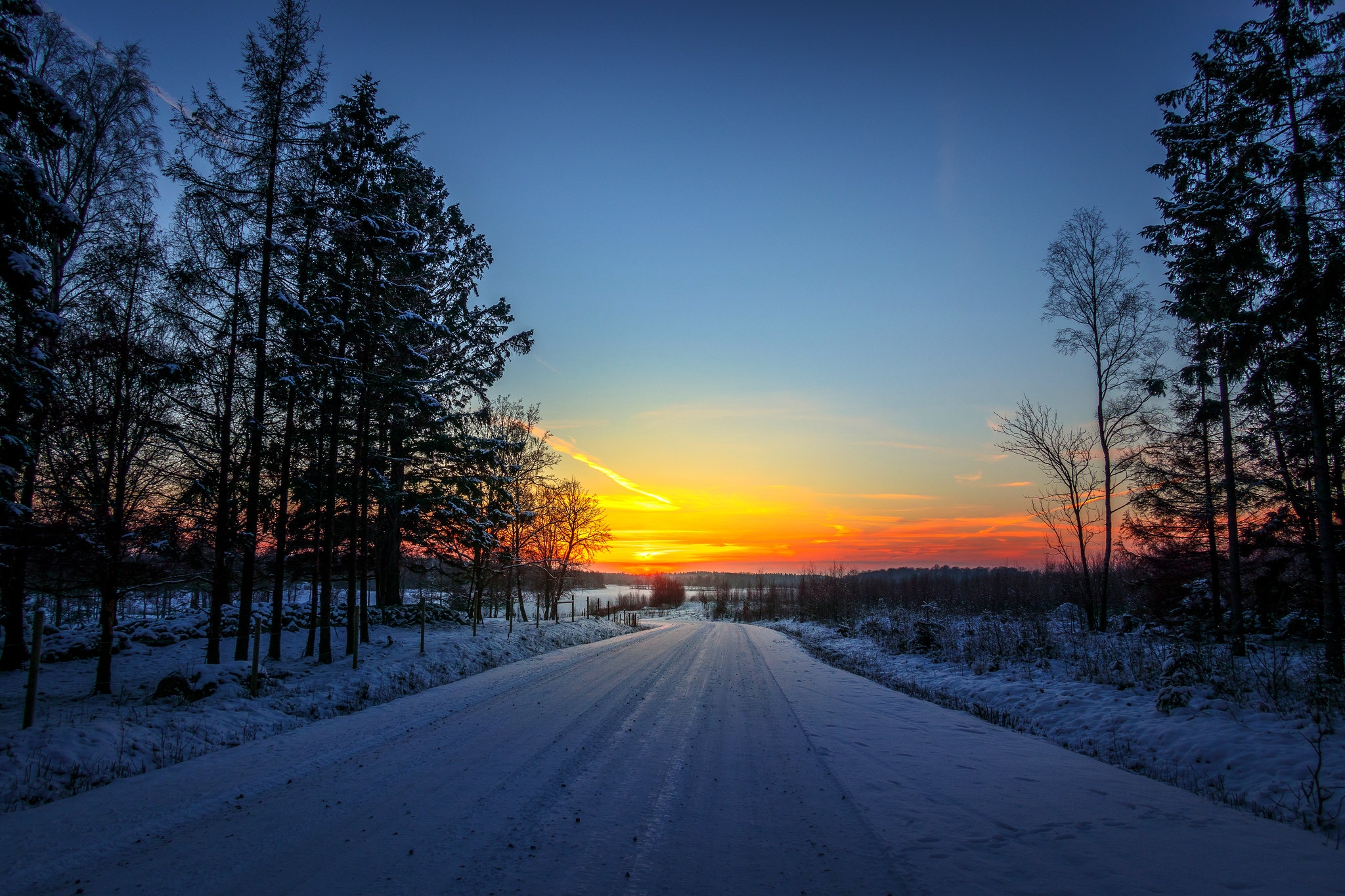 Winter road at sunset