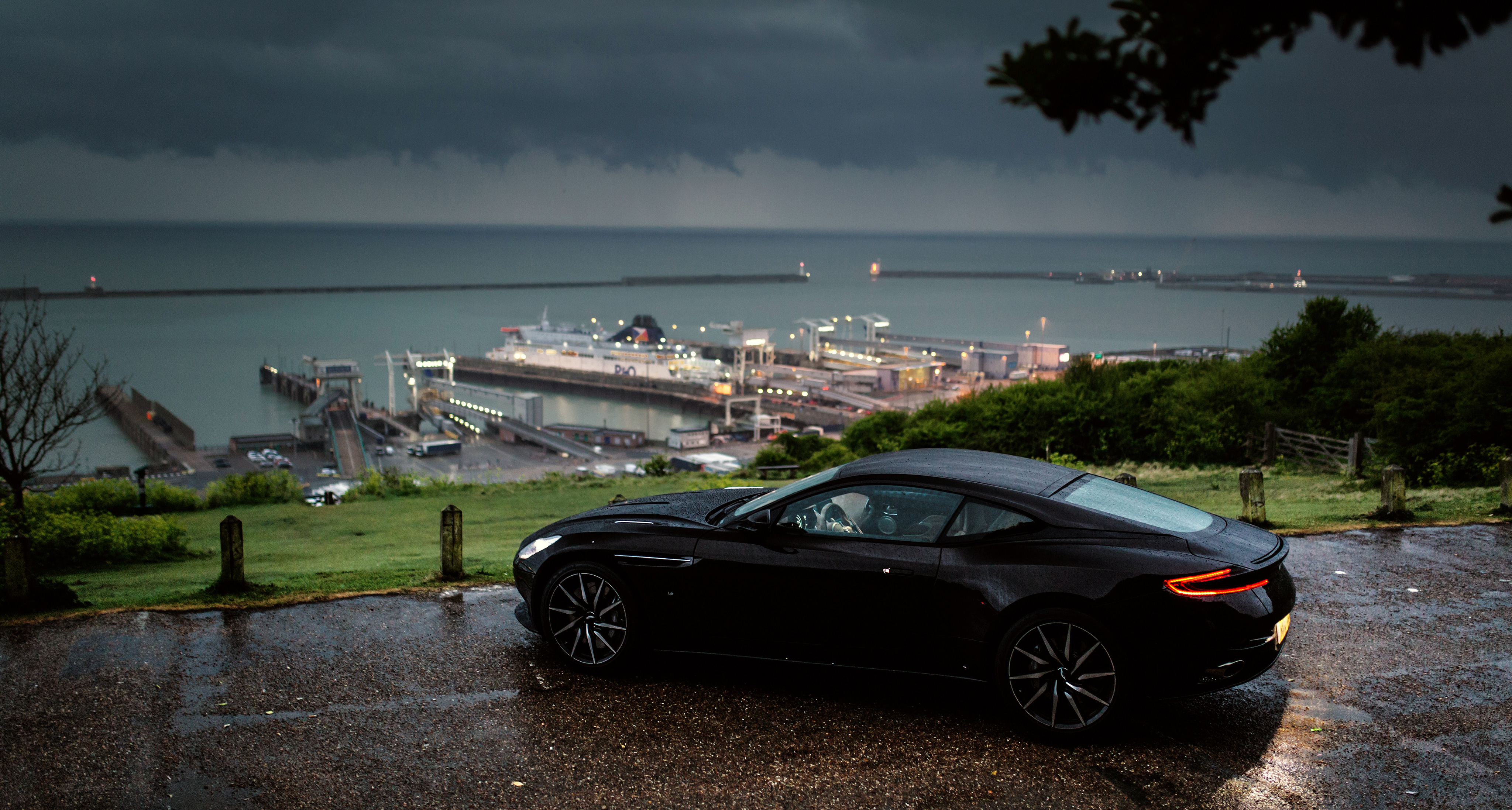 Free photo Aston Martin DB11 parked on the beach