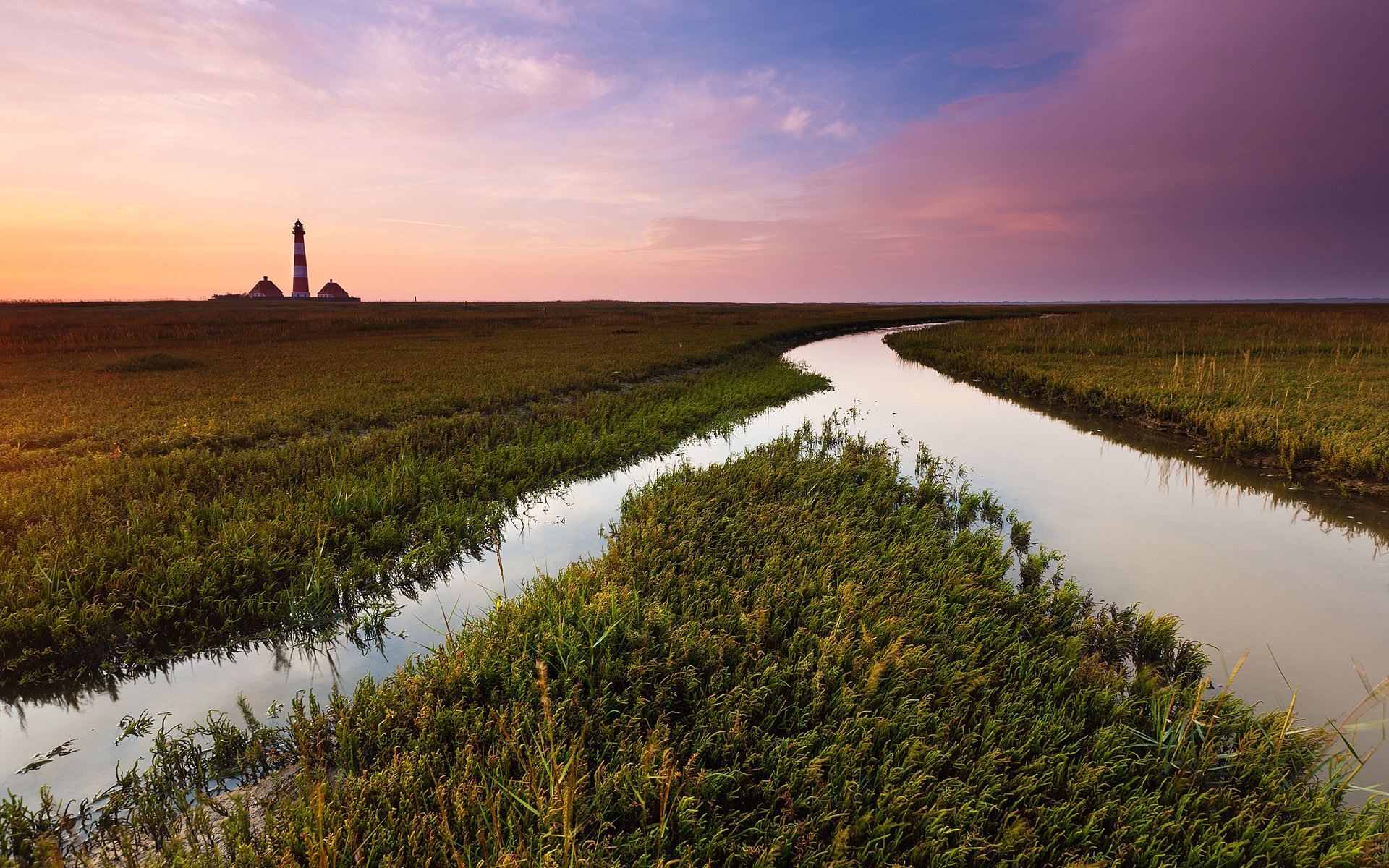 Free photo Waterworks in a field at sunset