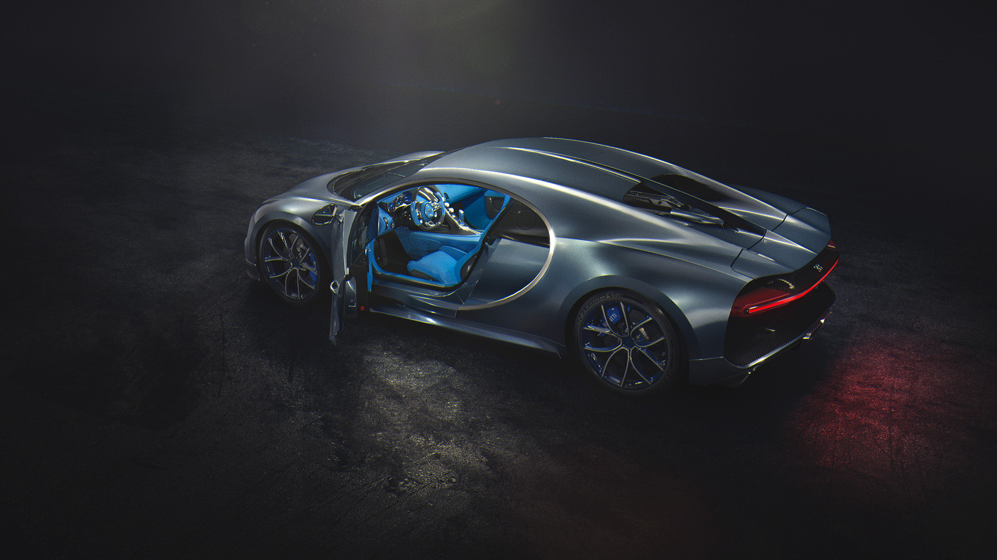 Free photo Grey Bugatti Chiron in the dark with blue interior