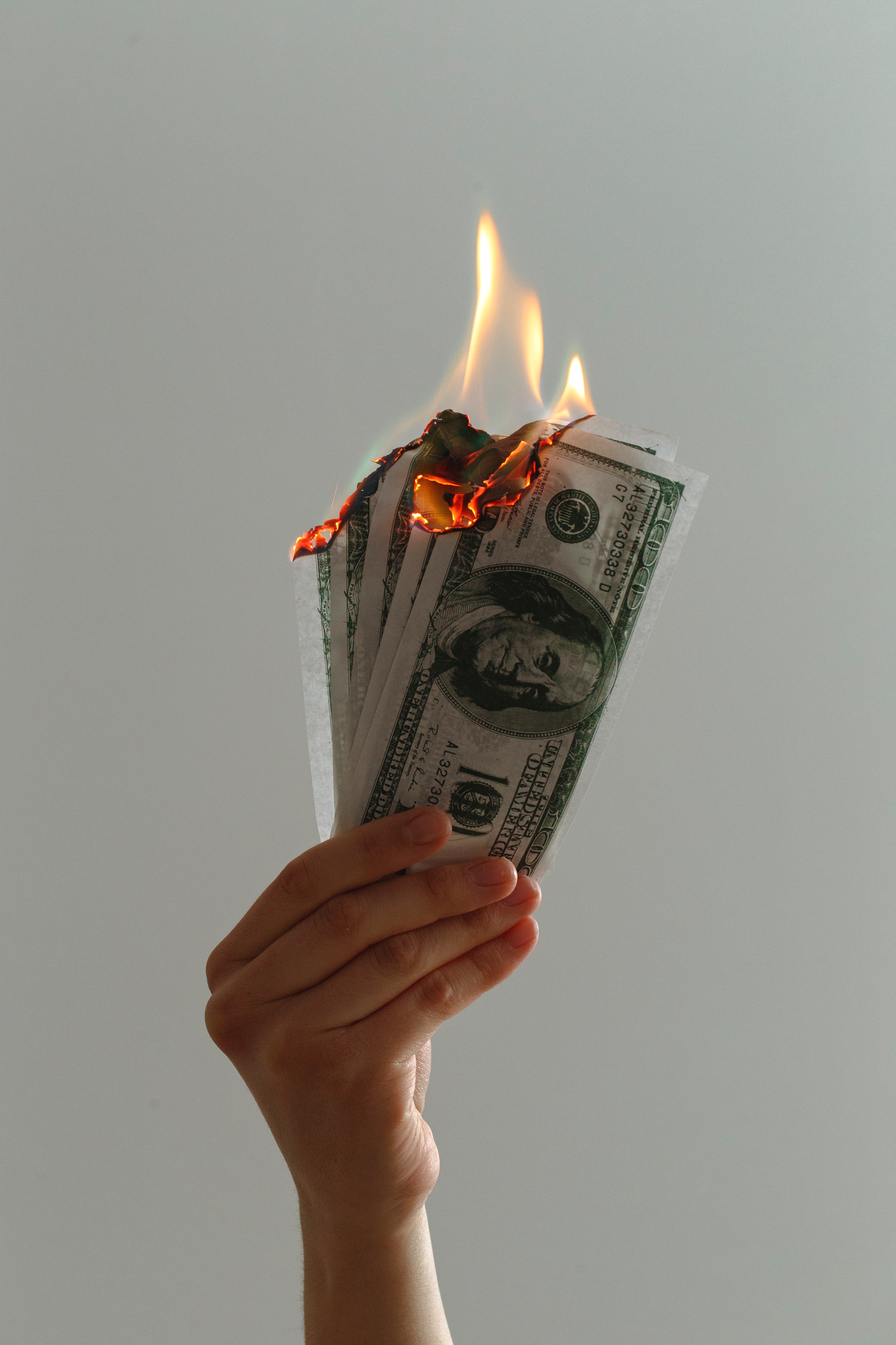 Free photo Dollars burning in my hand