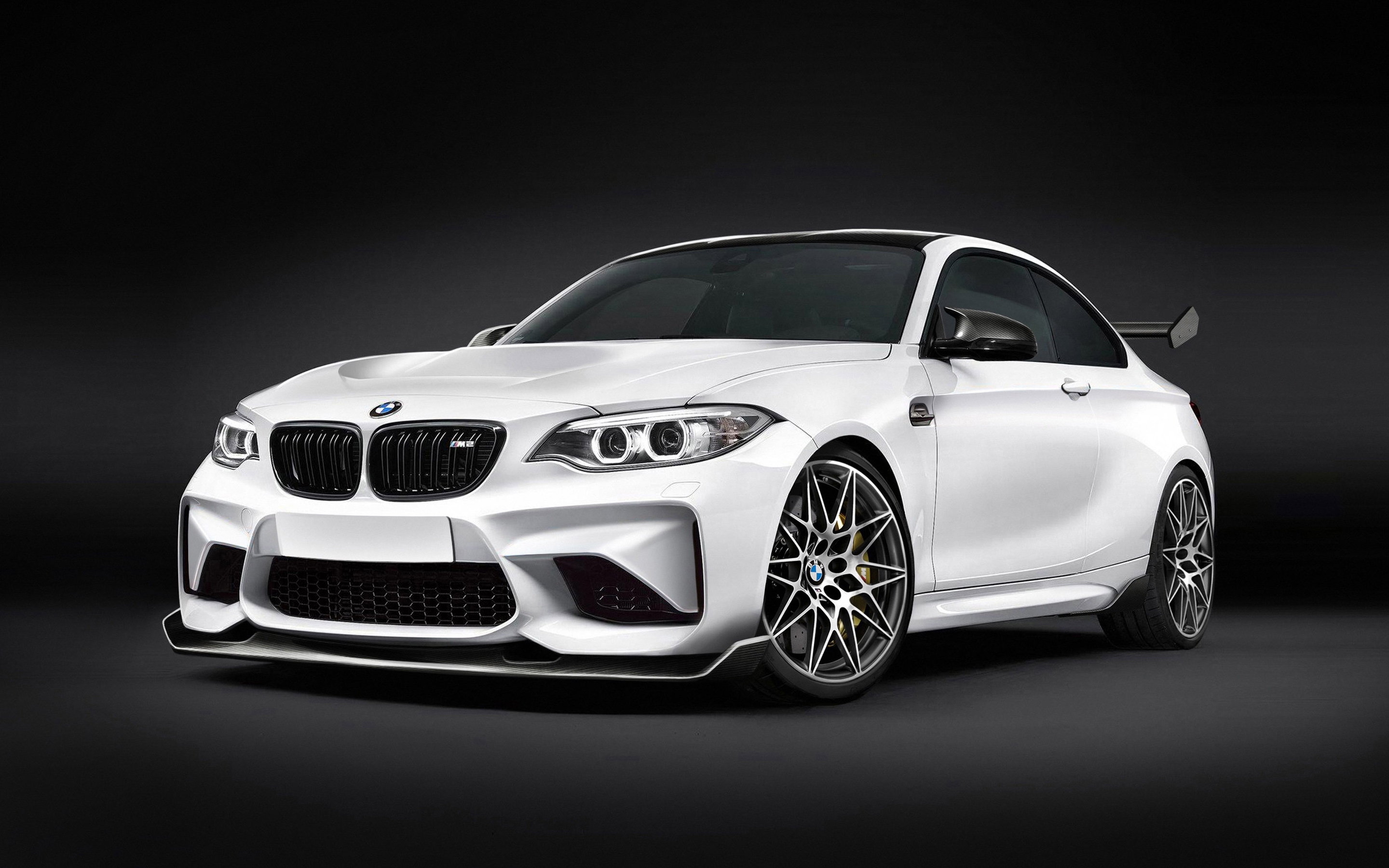 Free photo White BMW M2 on black background